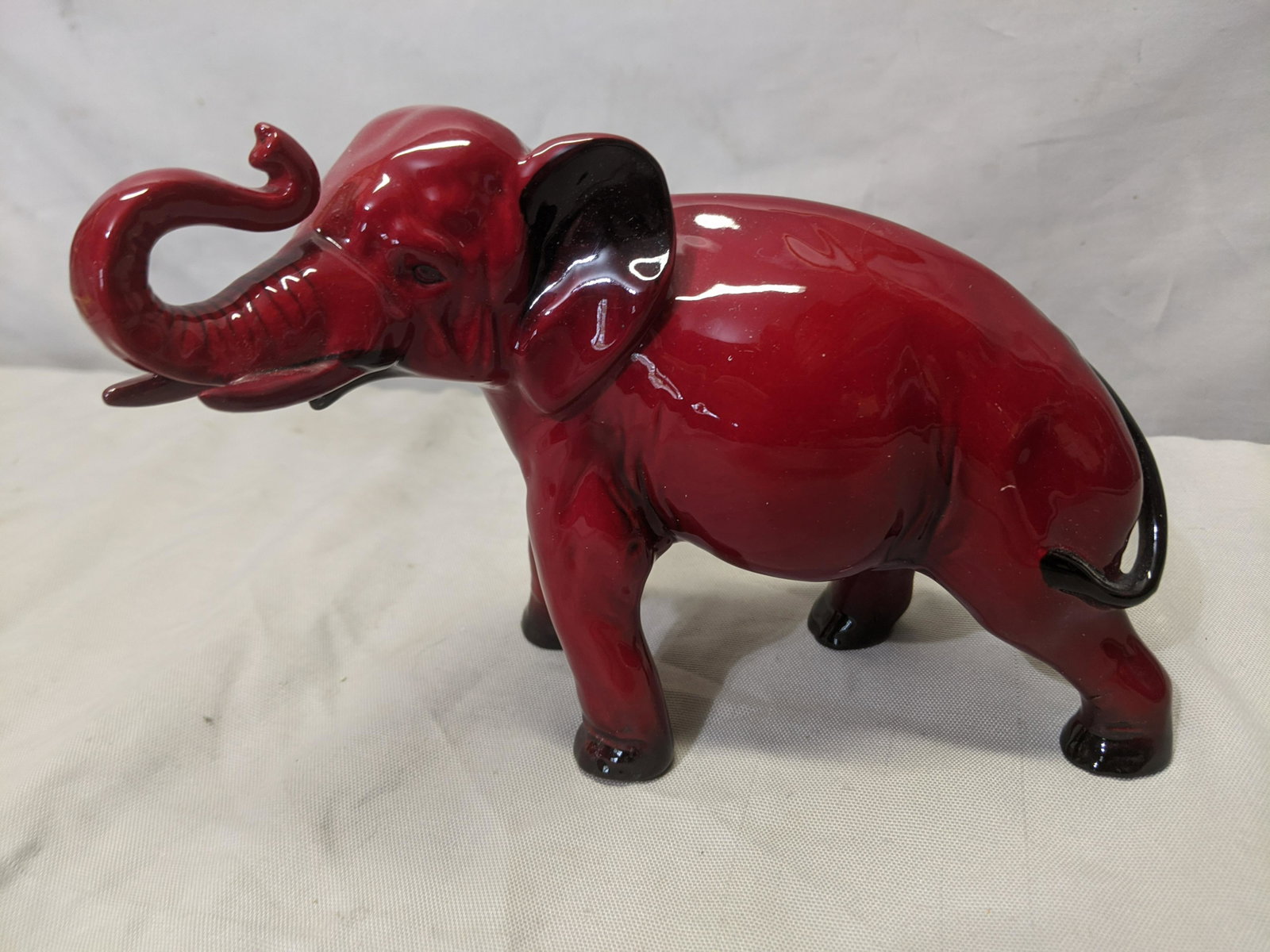 Royal Doulton Flambe Red Elephant Porcelain Figurine: Royal Doulton Flambe Red Elephant Porcelain Figurine 9 long Shipping in continental US $18.00 If shipping is $0 then buyer arranges pick up or shipping. Please ask any questions before bidding Good Lu