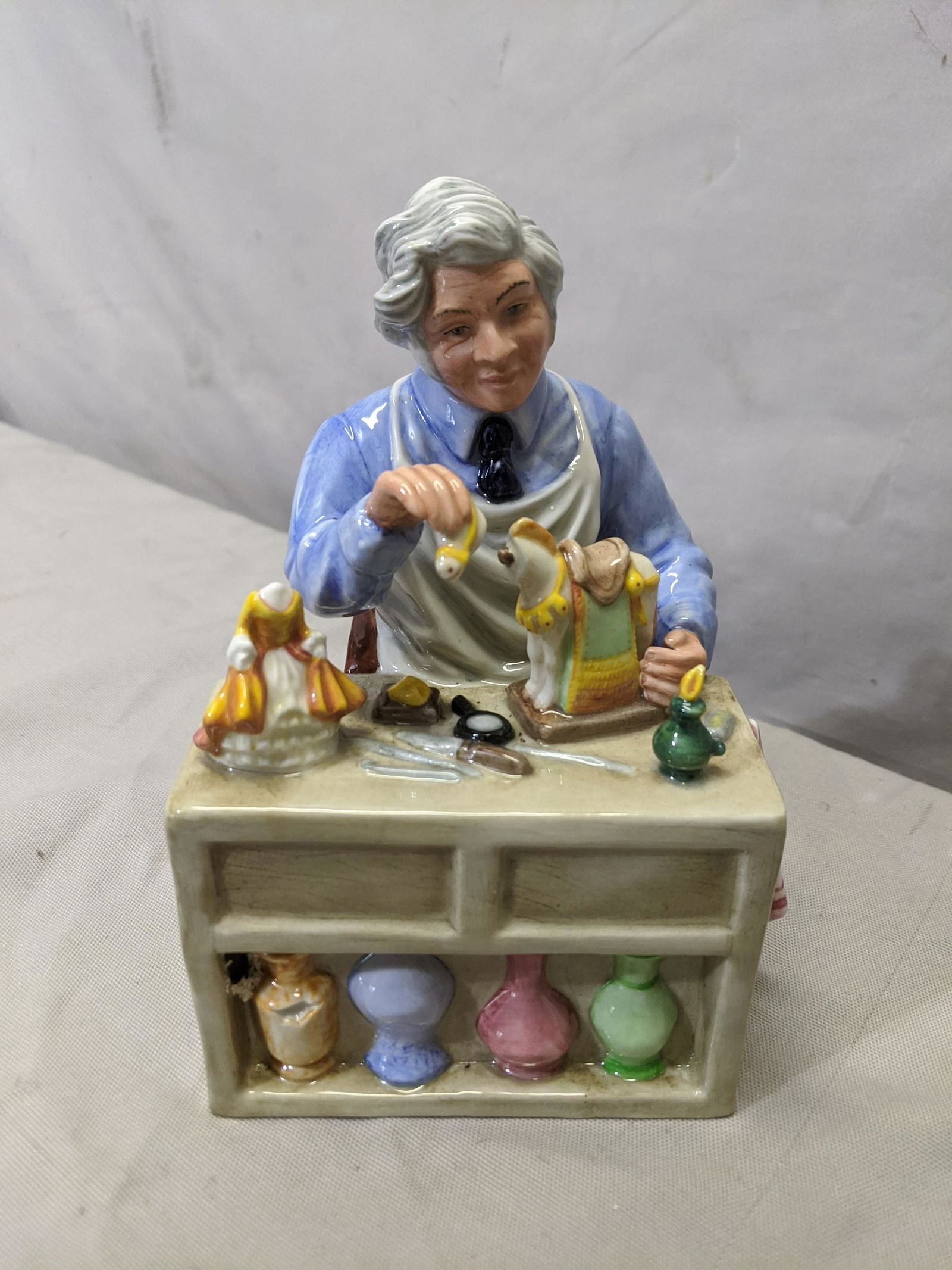 Royal Doulton Porcelain Figurine HN2943 The China: Royal Doulton Porcelain Figurine HN2943 The China Repairer 7 1/2 high Shipping in continental US $18.00 If shipping is $0 then buyer arranges pick up or shipping. Please ask any questions before biddi