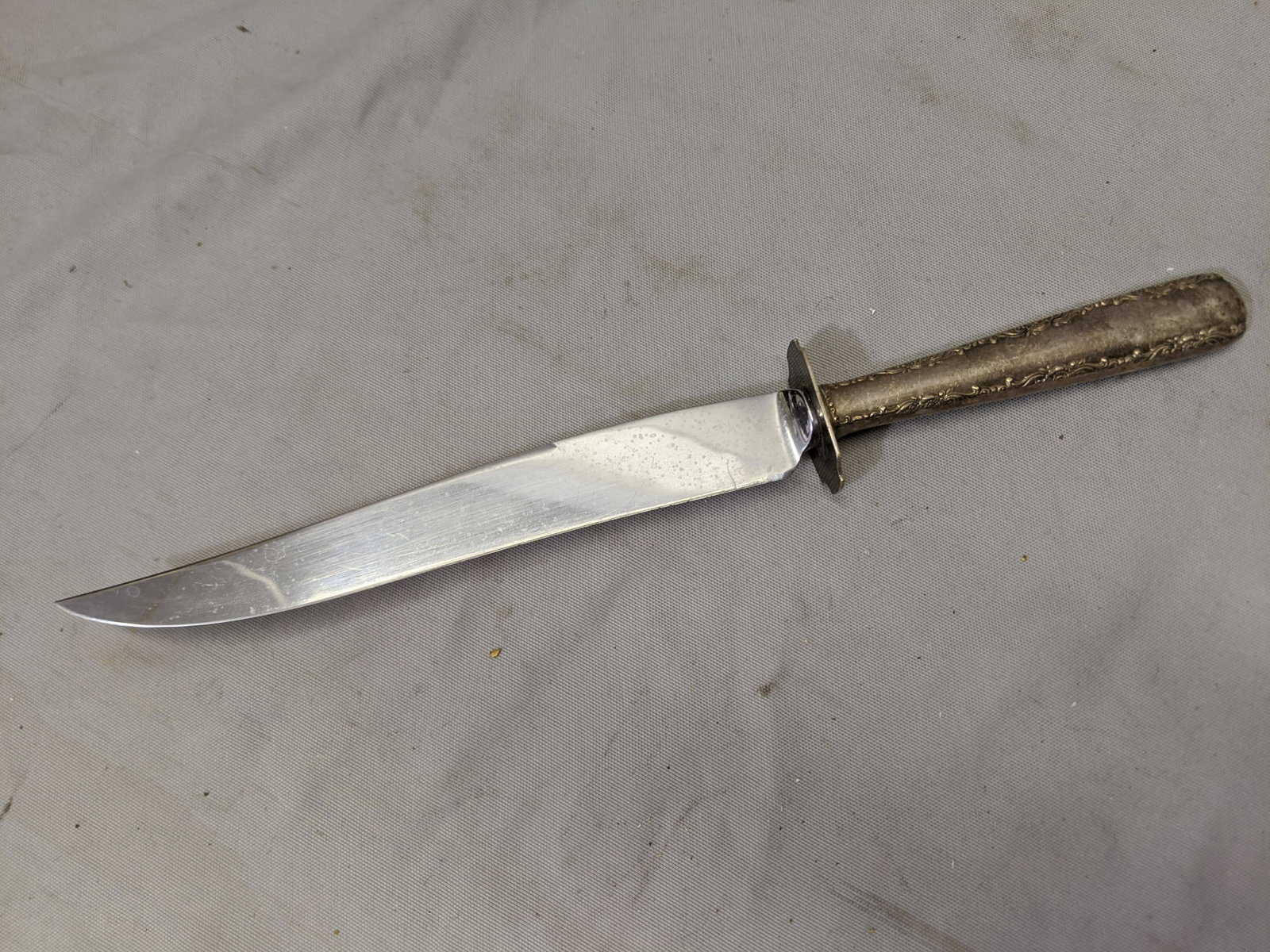 Old Carving Knife Stainless Blade Sterling Silver: Old Carving Knife Stainless Blade Sterling Silver Handle 13 long Shipping in continental US $8.00 If shipping is $0 then buyer arranges pick up or shipping. Please ask any questions before bidding Goo