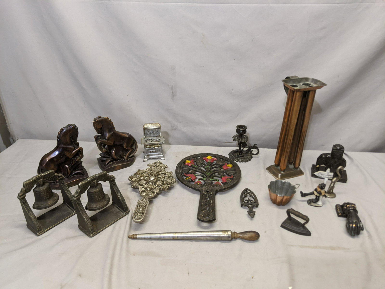 Lot 16 Assorted Metalware Items Bookends Trivets etc: Lot 16 Assorted Metalware Items Bookends, Trivets, candle holders door knocker, iron and more Shipping in continental US $25.00 If shipping is $0 then buyer arranges pick up or shipping. Please ask an