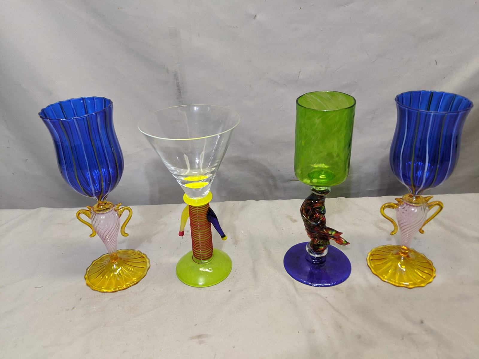 Lot 4 Fun Strange Hand Made Art Glass Wine Glasses: Lot 4 Fun Strange Hand Made Art Glass Wine Glasses. Measurements in inches:around 9 high We offer in-house shipping. Item(s) will be packed after invoice is paid and shipping cost will be collected se