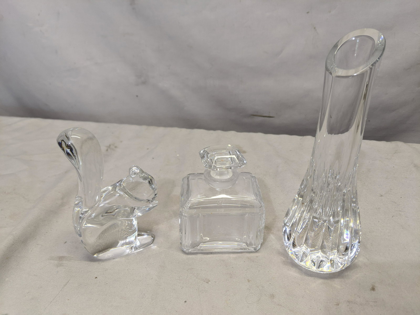 Lot 3 Baccarat Crystal Squirrel Figurine Vase & Perfume: Lot 3 Baccarat Crystal Squirrel Figurine Vase & Perfume Bottles. Measurements in inches:7 1/4 high vase, 5 high squirrel, 3 1/2 high perfume We offer in-house shipping. Item(s) will be packed after in