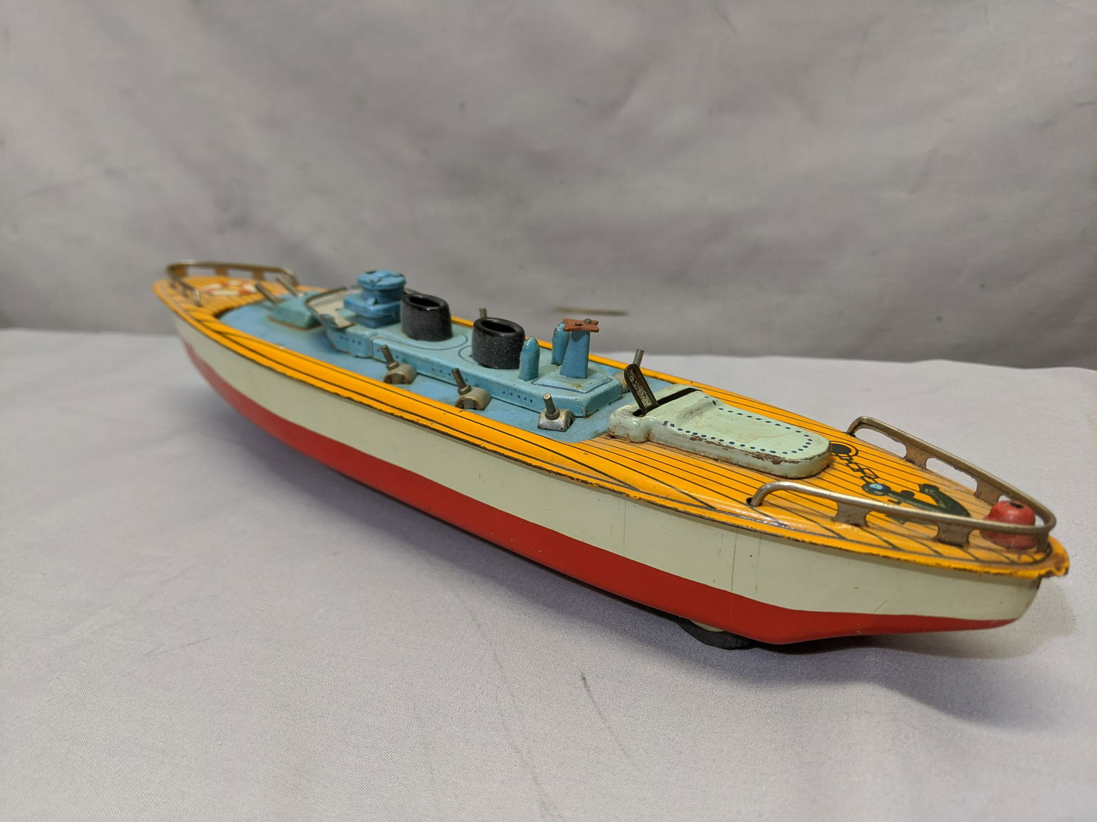 Vintage Japan Tin Friction Litho Warship Cruise Ship: Vintage Japan Tin Friction Litho Warship Cruise Ship Flip Toy. Measurements in inches:12 long We offer in-house shipping. Item(s) will be packed after invoice is paid and shipping cost will be collect