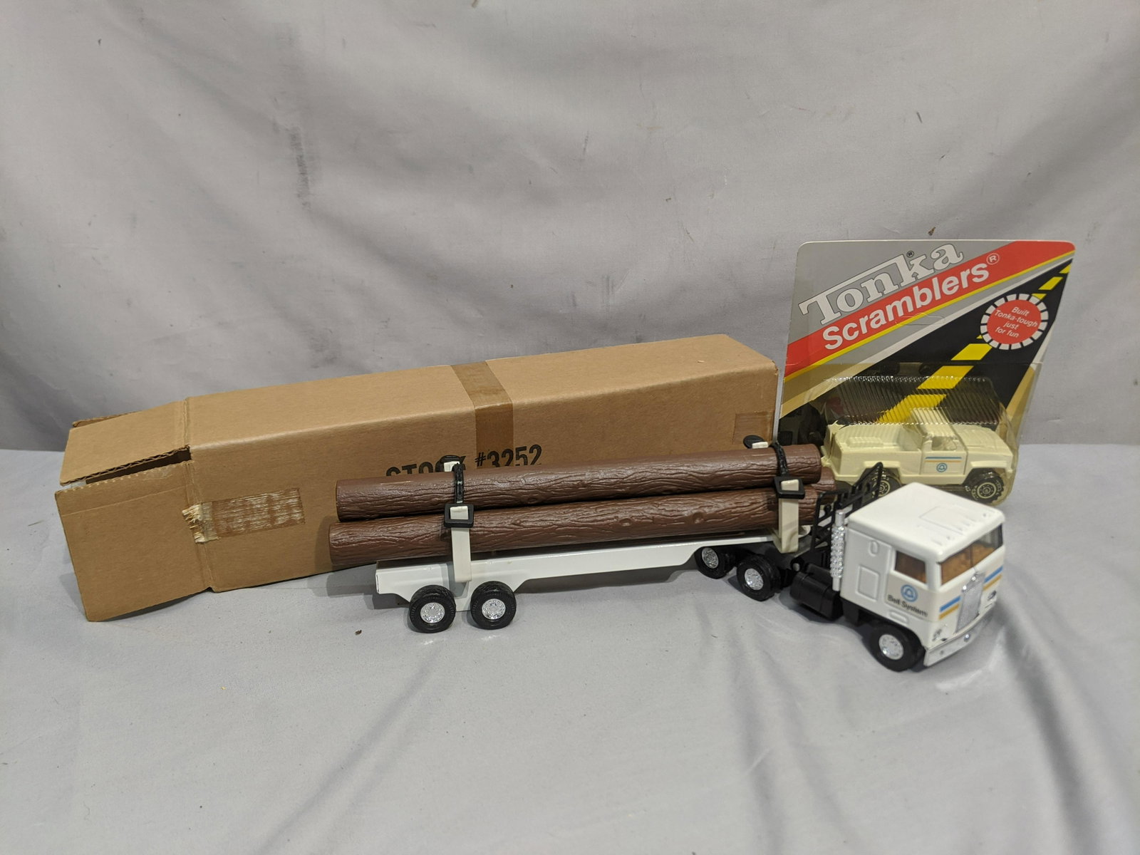 NOS Bell System Tonka Scrambler Pick Up & Ertle Logger: NOS Bell System Tonka Scrambler Pick Up & Ertle Logger in packages. We offer in-house shipping. Item(s) will be packed after invoice is paid and shipping cost will be collected seperatly via the Shipp