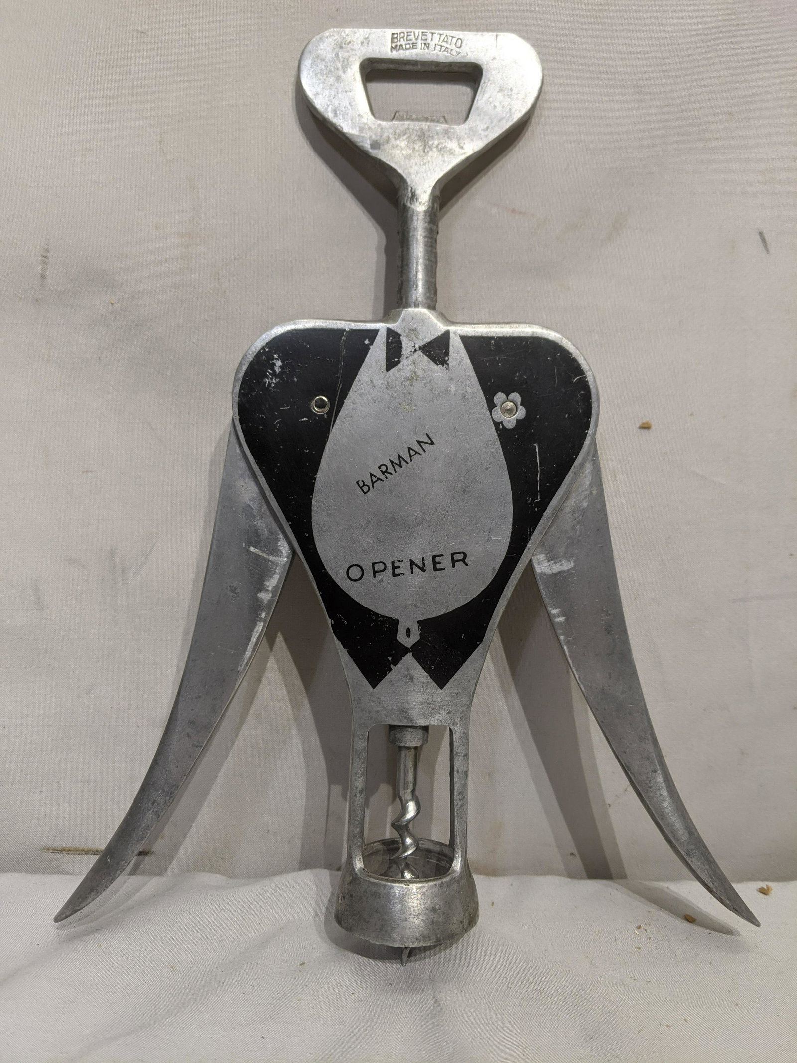 Vintage Brevettato Italy Barman Wine Bottle Opener: Vintage Brevettato Italy Barman Wine Bottle Opener. Measurements in inches: 11 long Condition:Normal wear with age and use Shipping:We offer in-house shipping. Item(s) will be packed after invoice is 