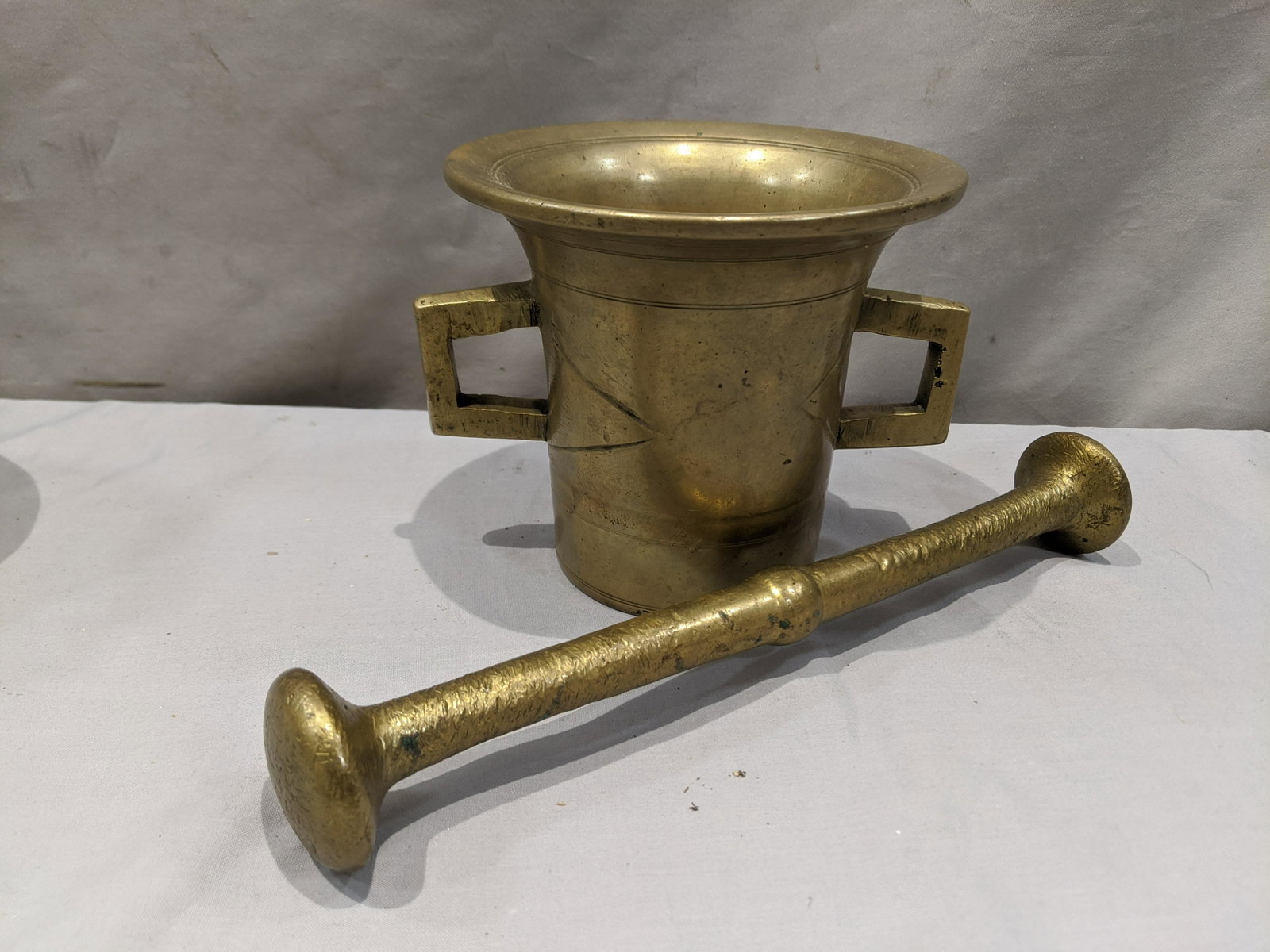 Vintage Russian Sand Cast Brass Mortar & Pestle: Vintage Russian Sand Cast Brass Mortar & Pestle. Measurements in inches: 5 high x 5 1/2 diameter Condition:Good with no problems Shipping:We offer in-house shipping. Item(s) will be packed after invoi
