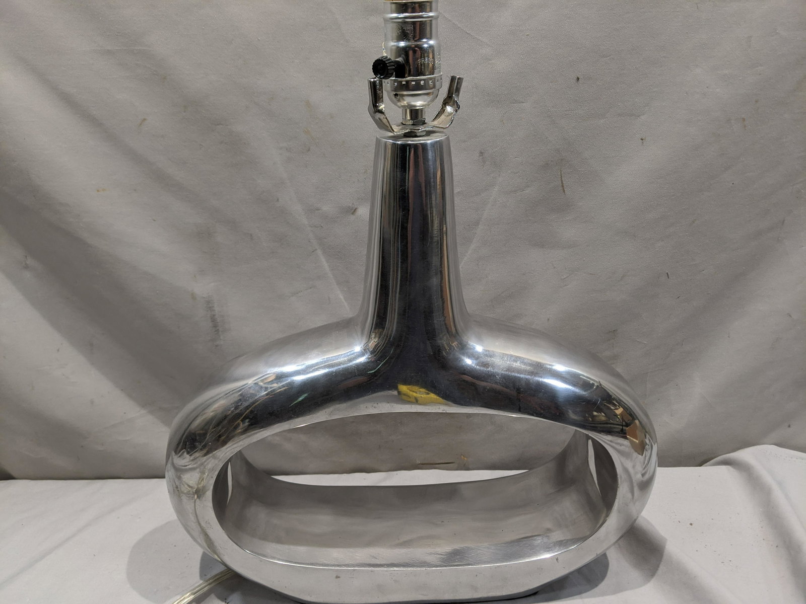 Vintage Brushed Aluminum Modern Through Hole Table Lamp: Vintage Brushed Aluminum Modern Through Hole Table Lamp. Measurements in inches: 18 high x 15 x 4 Condition:No harp or finial. Works fine Shipping:We offer in-house shipping. Item(s) will be packed af