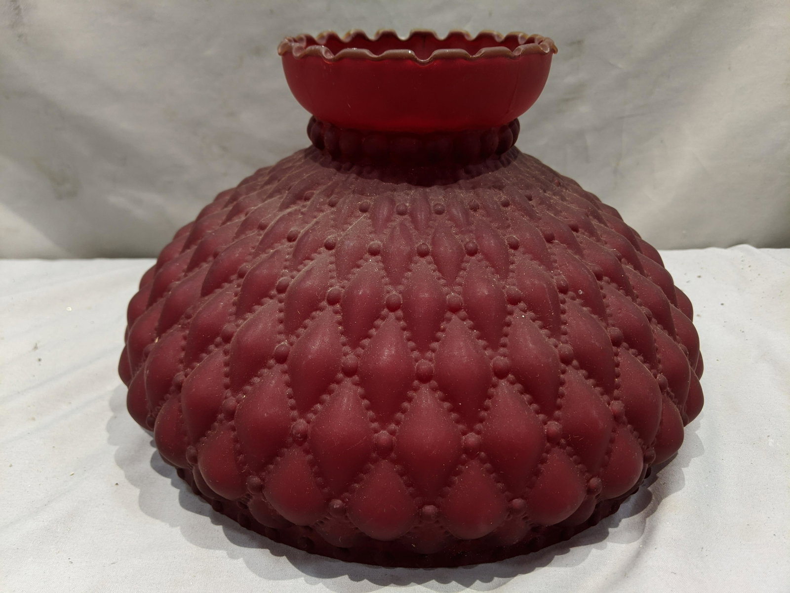 Antique Red Satin Glass Ornate Lamp Dome Shade: Antique Red Satin Glass Ornate Lamp Dome Shade. Measurements in inches: 7 high x 11 diameter Condition:No chips or cracks, needs a good cleaning Shipping:We offer in-house shipping. Item(s) will be pa