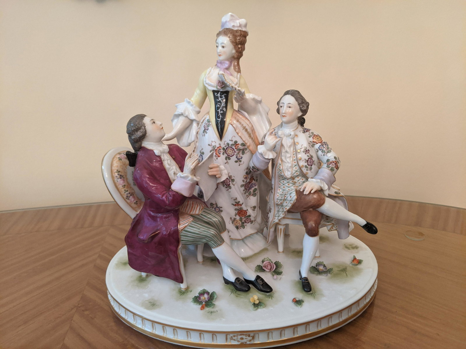 Antique Bavarian Porcelain 3 Figure Grouping: Antique Bavarian Porcelain 3 Figure Grouping marked with a double y type mark on bottom. Measurements in inches: 8 1/2 high x 9 x 6 Condition:One flower is chipped on floor Shipping:We offer in-house 