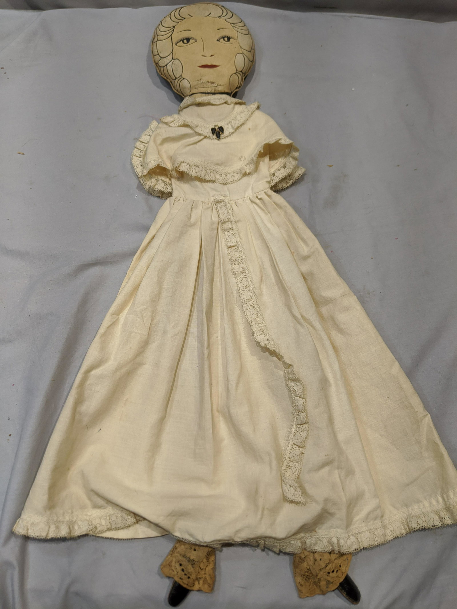 Antique Oil Cloth Rag Painted Doll on Woman: Antique Oil Cloth Rag Painted Doll on Woman. Measurements in inches: 21 high Condition:Well worn with age and use, some browning to cloth Shipping:We offer in-house shipping. Item(s) will be packed af