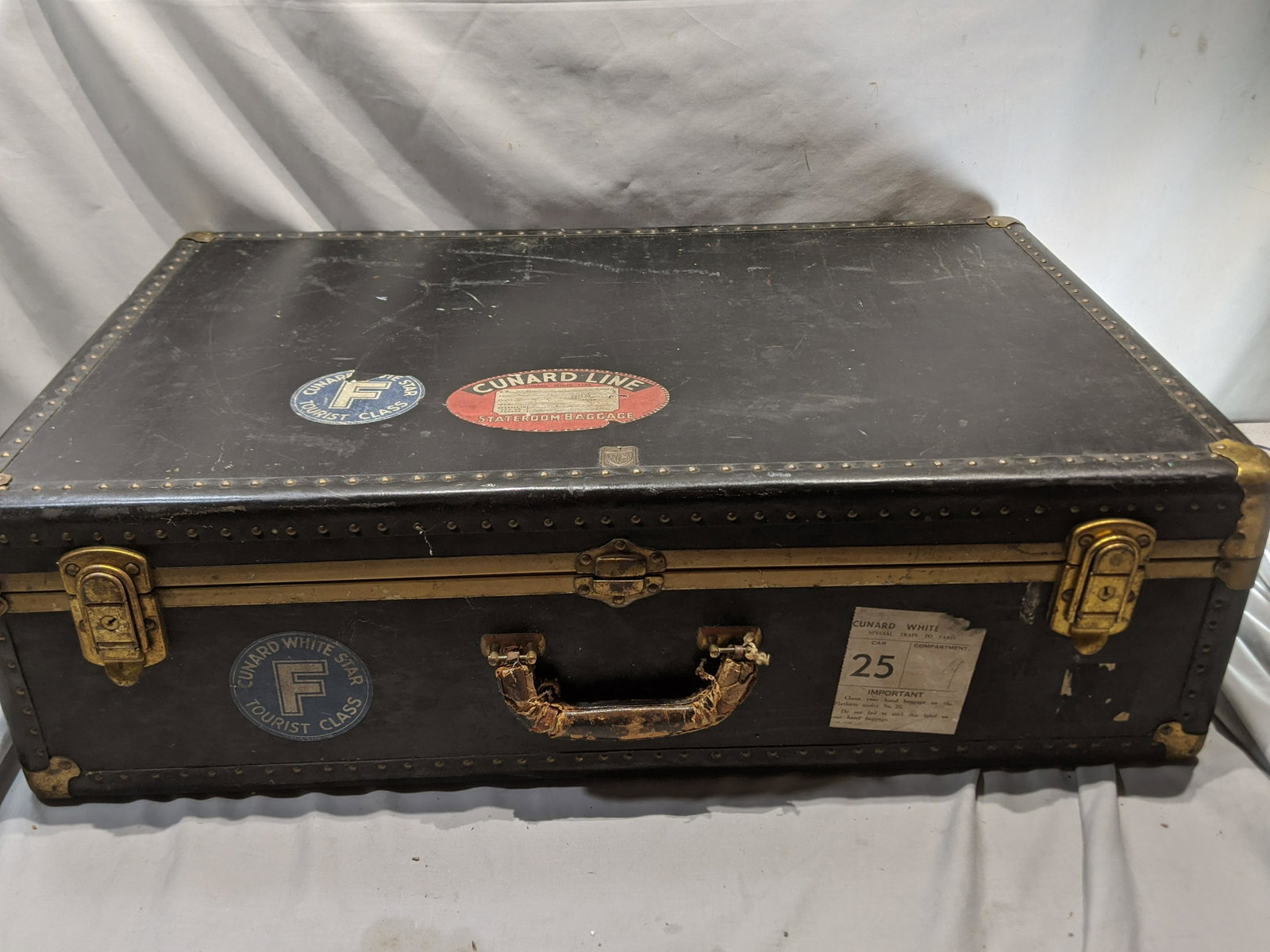 Antique Cunard Lines Queen Mary US Trunk Co Luggage: Antique Cunard Lines Queen Mary US Trunk Co Luggage with several Cunard lines decals applied. Measurements in inches: 32 x 20 x 9 1/2 Condition:Normal wear with age Shipping:We offer in-house shipping
