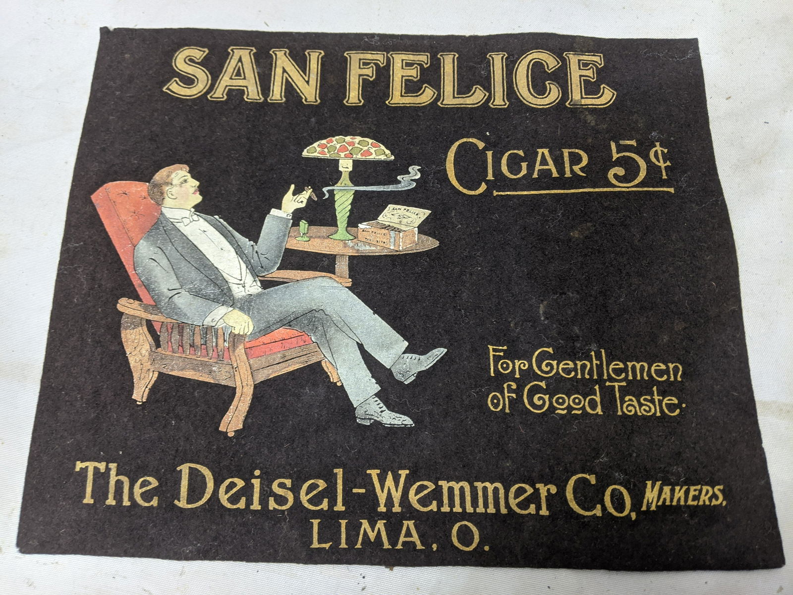 Deisel-Wemmer Co San Felice Cigar Embossed Counter Clo: Deisel-Wemmer Co San Felice Cigar Embossed Counter Cloth made by the Reproduction Co. Measurements in inches: 1lb, 11 1/2 x 13 3/4 Condition:Good with no problems Shipping:We offer in-house shipping.