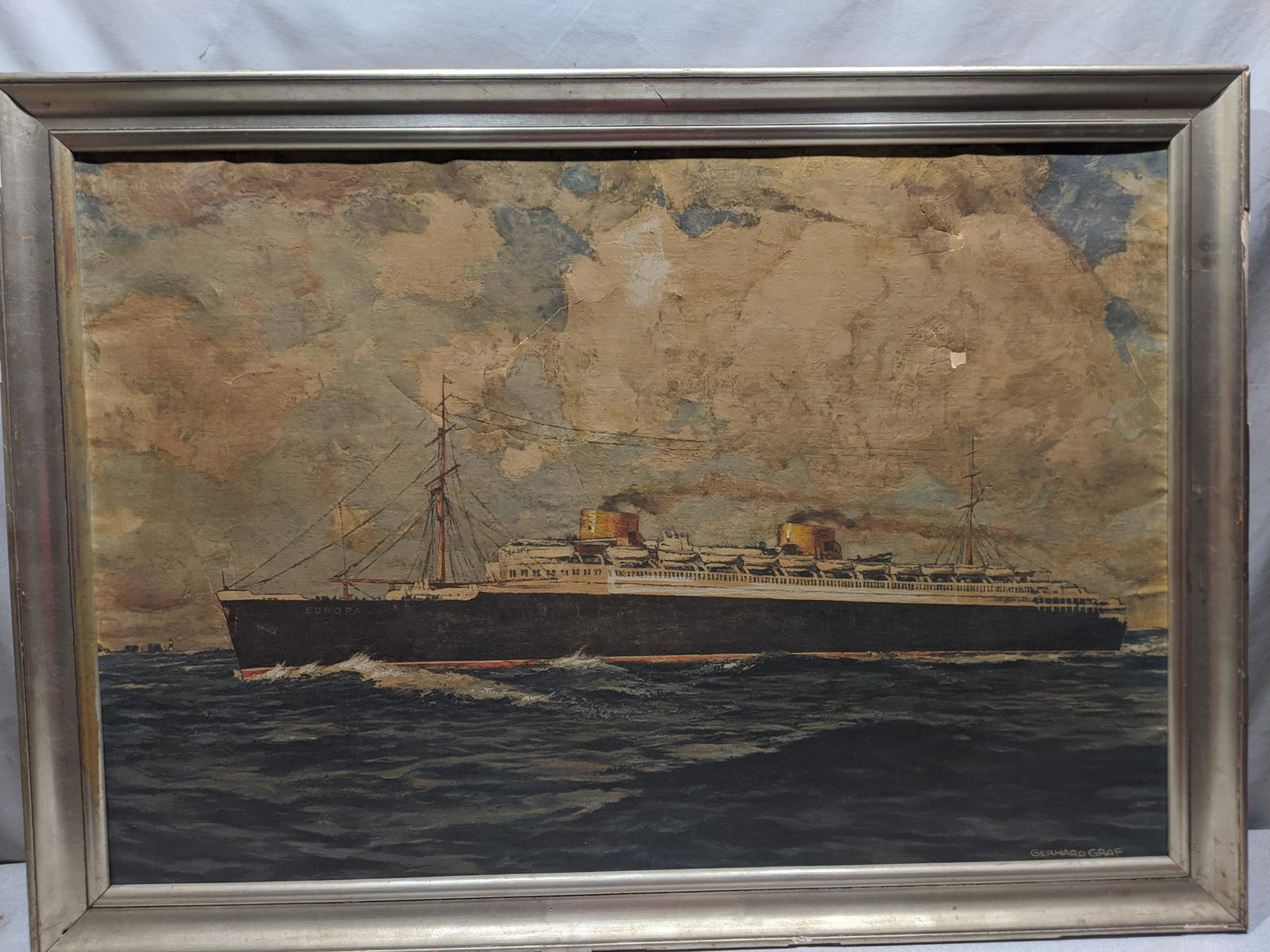 Europa Large Gerhard Graf Steamship Print on Canvas: Europa Large Gerhard Graf Steamship Print on Canvas in frame. Measurements in inches: 42 1/2 x 30 1/2 Condition:Frame has chipping. Paint has chipping and large tear Shipping:We offer in-house shippin