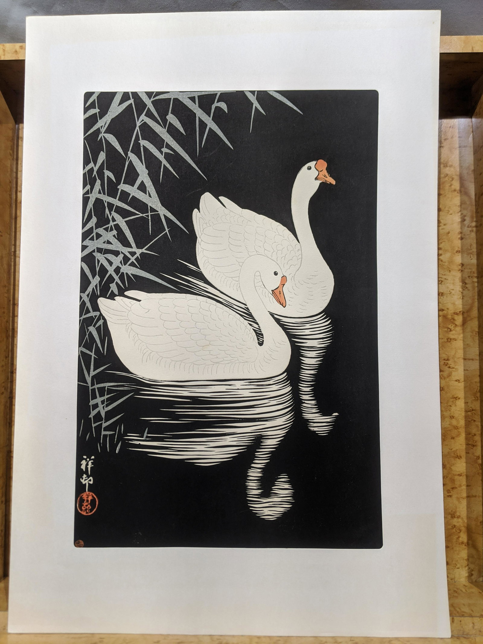c1945 Ohara Koson Swan & Reed Japanese Woodblock Print: c1945 Ohara Koson Swan & Reed Japanese Woodblock Print, later printing. Measurements in inches: 10 1/4 x 15 1/4 Condition:Tipped on paper on left edge Shipping:We offer in-house shipping. Item(s) will