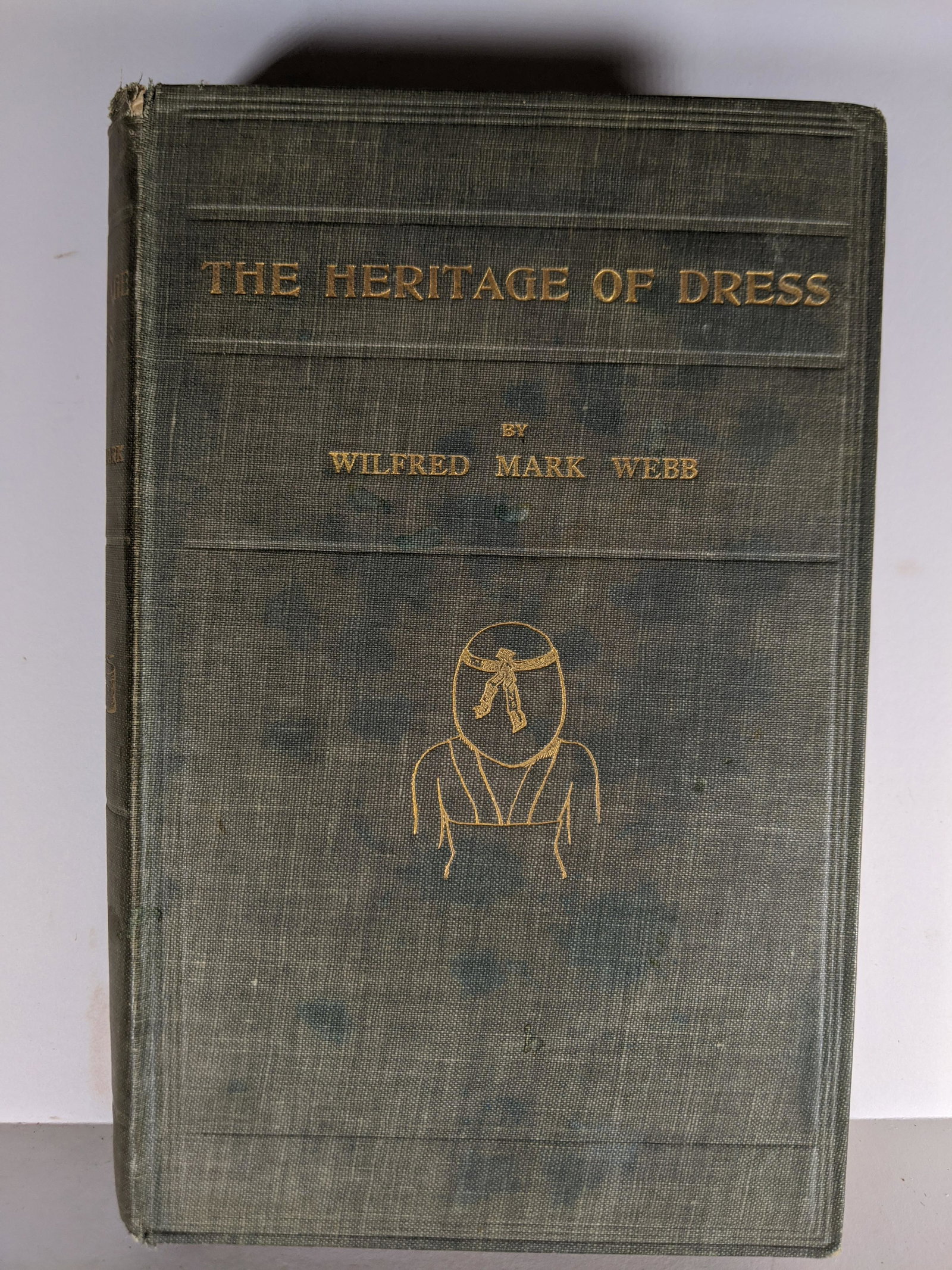 1912 The Heritage of Dress Wilfred Mark Webb: 1912 The Heritage of Dress Wilfred Mark Webb. Measurements in inches: 6 x 9 Condition:Has wear to cover and some toing to early pages inside Shipping:We offer in-house shipping. Item(s) will be packed