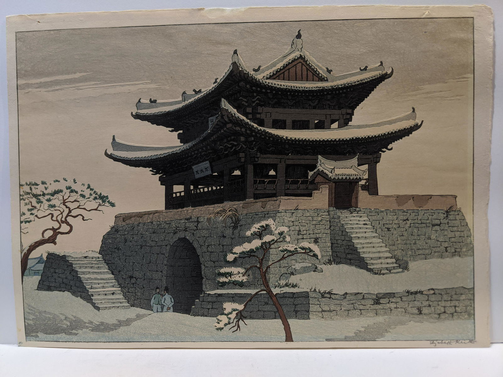 Elizabeth Keith Woodblock Print Korean Temple in Snow: Elizabeth Keith Woodblock Print Korean Temple in Snow. Measurements in inches: 18 3/4 x 13 1/4 Condition:Has mat burn, uneven left and bottom edge, thinning top margin. Pinholes in top margin Shipping