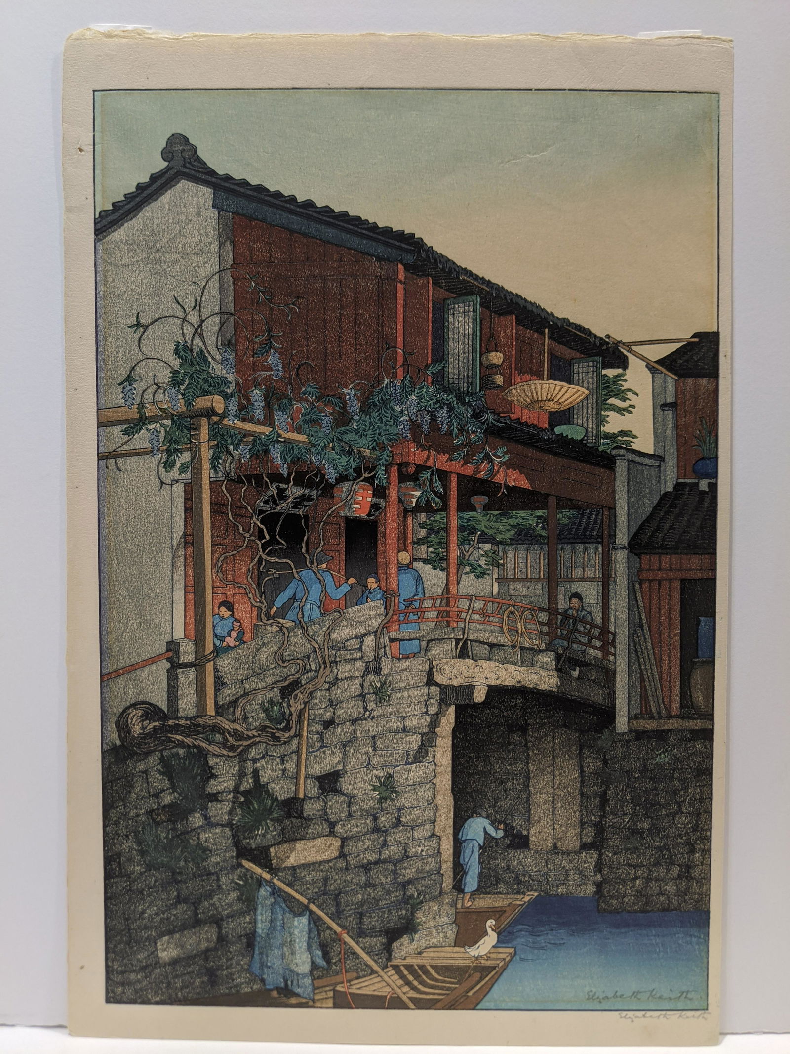 1925 Elizabeth Keith Woodblock Print Wisteria Bridge: 1925 Elizabeth Keith Woodblock Print Wisteria Bridge. Measurements in inches: 16 1/4 x 10 3/4 Condition:Has mat burn, uneven right edge, pinholes left margin and tape on reverse top edge. Shipping:We
