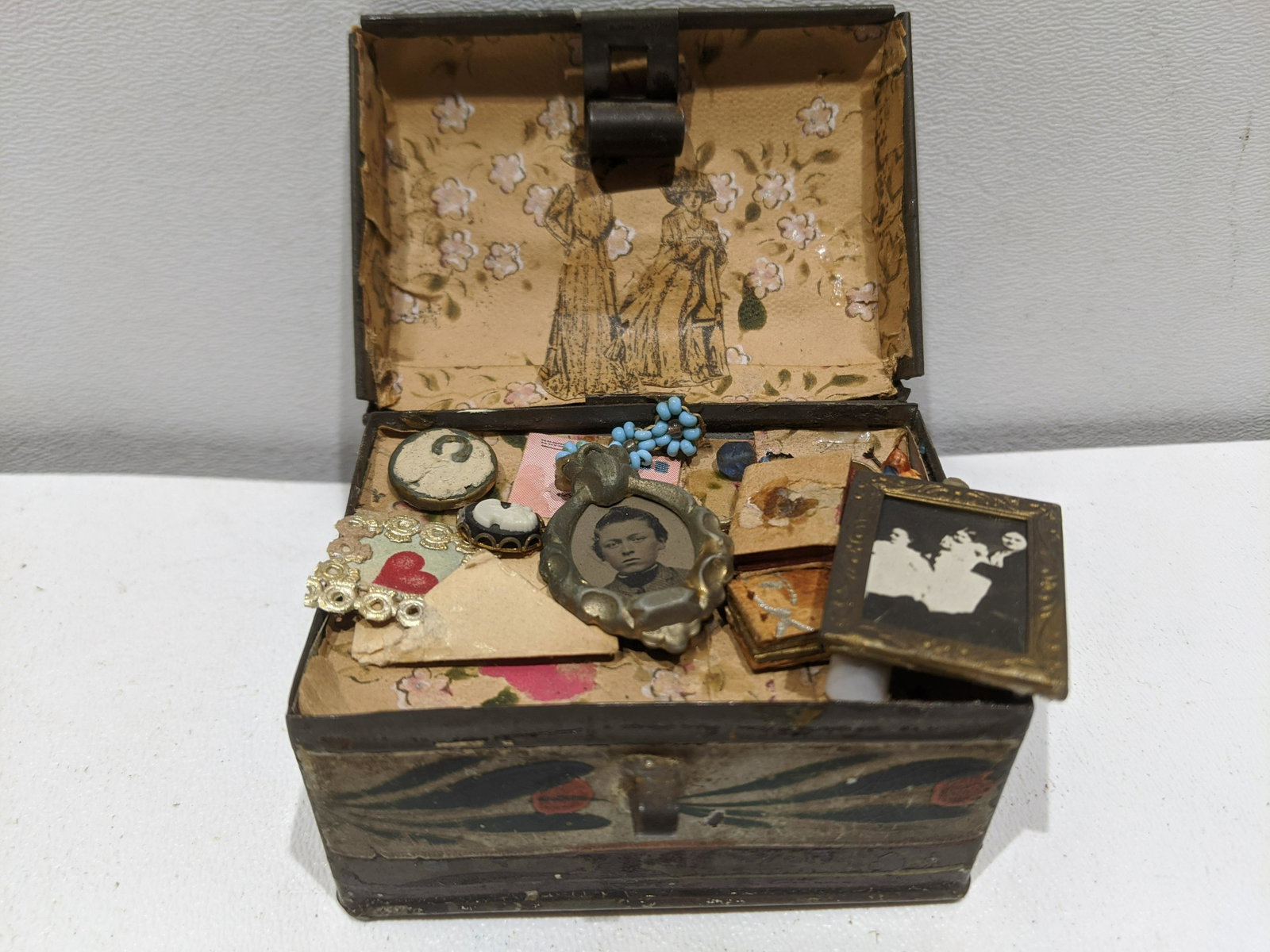 19th Century Miniature Tin Hope Chest w/ Trinkets: 19th Century Miniature Tin Hope Chest with trinkets inside. Measurements in inches: 3 x 2 x 2 high Condition:Shows wear with age and use Shipping:We offer in-house shipping. Item(s) will be packed aft