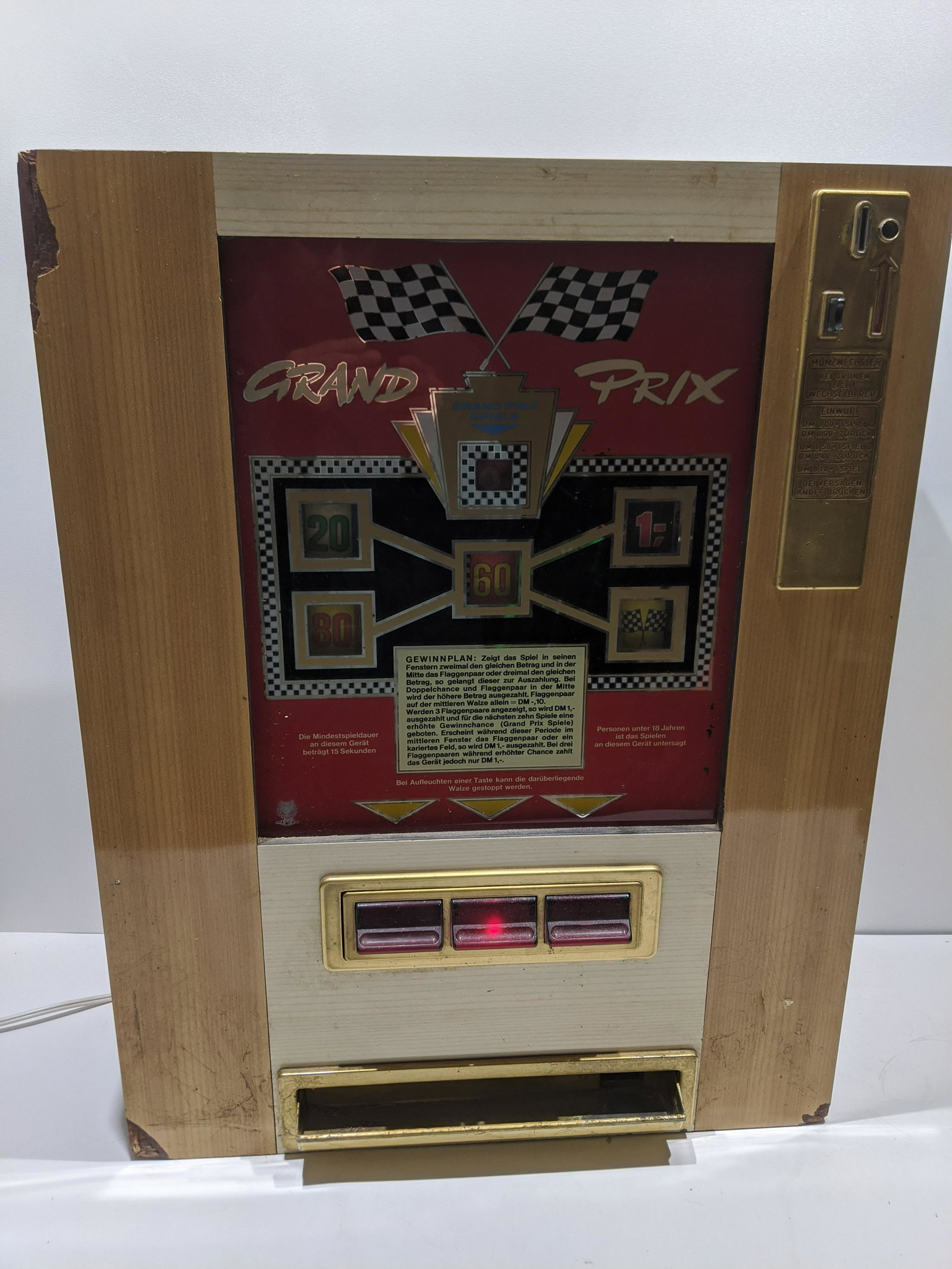 Vintage German Grand Prix Spiel Slot Machine Trade Stim: Vintage German Grand Prix Spiel Slot Machine Trade Stimulator.. Measurements in inches: 29 high x 8 x 22. 67 lbs Condition:Lights up but not tested any further. Converted to 110 at one point. Cabinet 
