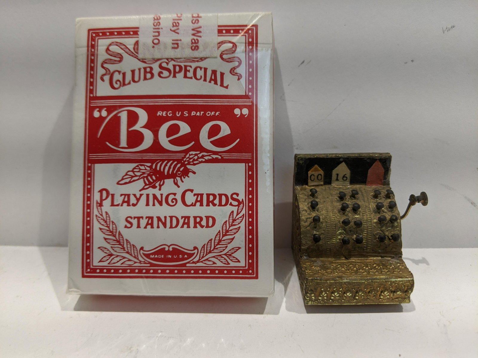 Antique Painted Wood Ornate Miniature Cash Register: Antique Painted Wood Ornate Miniature Cash Register. Measurements in inches: 1 1/2 high Condition:Shows wear with age and use Shipping:We offer in-house shipping. Item(s) will be packed after invoice 