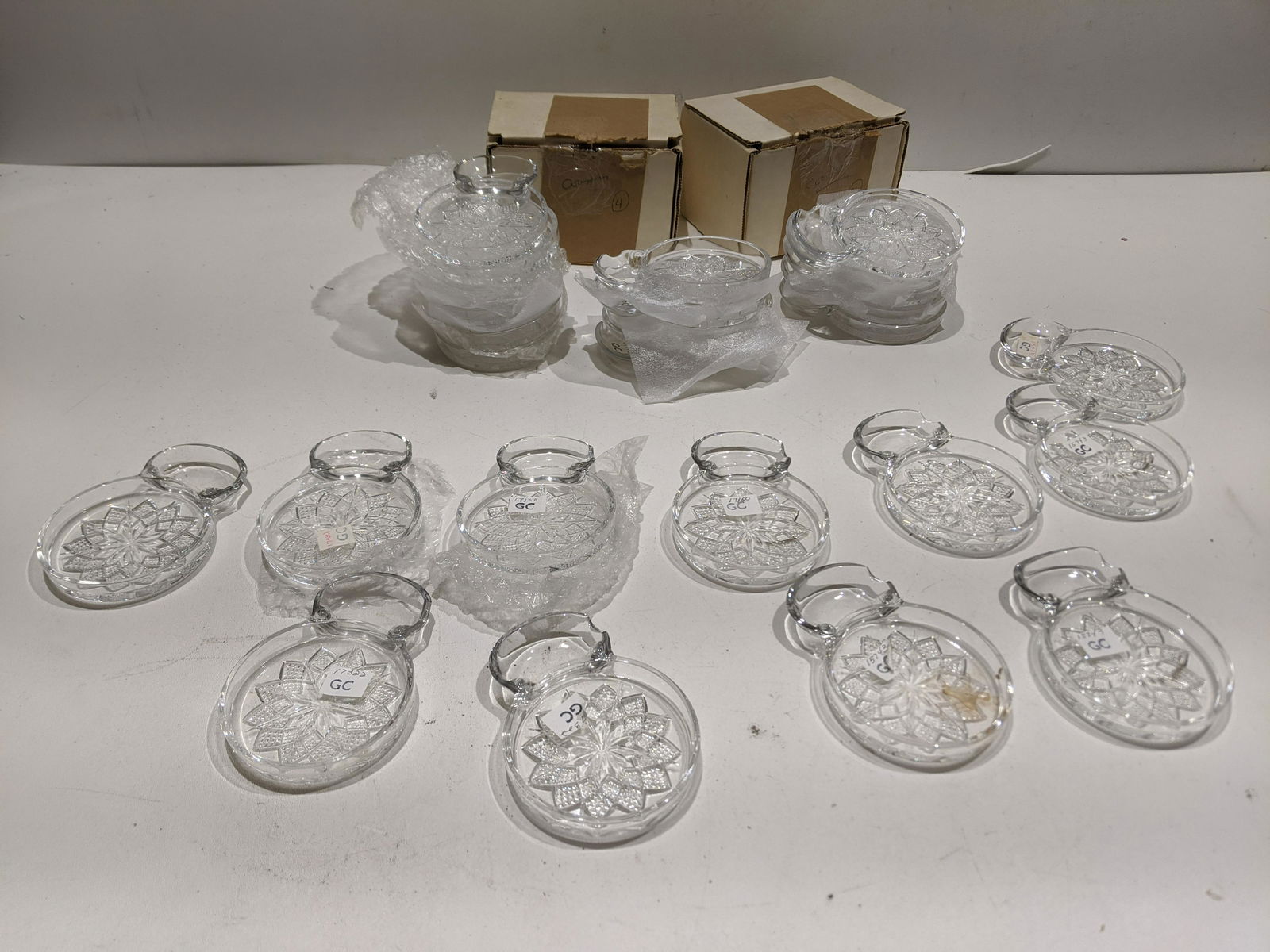 Lot 26 Fostoria Lead Crystal Coasters: Lot 26 Fostoria Lead Crystal Coasters including some in cordial boxes. Condition:As found, Sold as is. No obvious cracks or chips Shipping:We offer in-house shipping. Item(s) will be packed after invo
