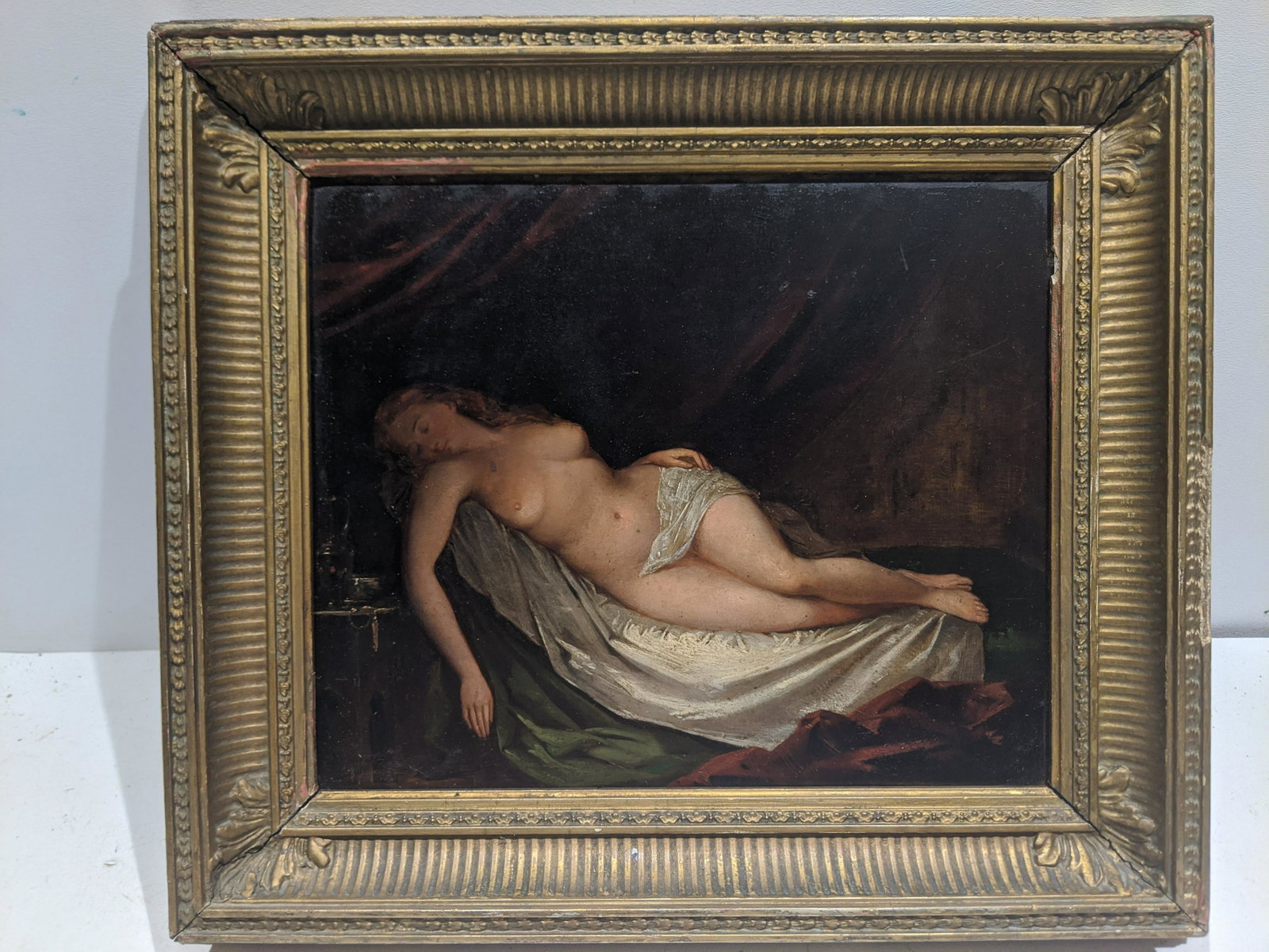 Art Deco Reclining Nude Oil on Board Painting: Art Deco Reclining Nude Oil on Board Painting in frame. Very fine detail and workmanship. Unsigned. Measurements in inches: 16 x 14, image: 11 1/4 x 9 1/4 Condition:Has some touch up lower left Shippi