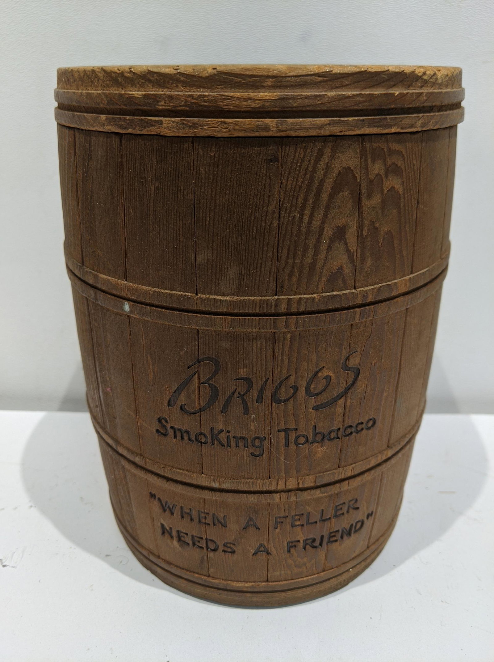 Antique Briggs Smoking Tobacco Wood Barrell Container: Antique Briggs Smoking Tobacco Wood Barrell Container. Measurements in inches: 7 high x 5 1/2 diameter Condition:Normal wear with age and use Shipping:We offer in-house shipping. Item(s) will be packe