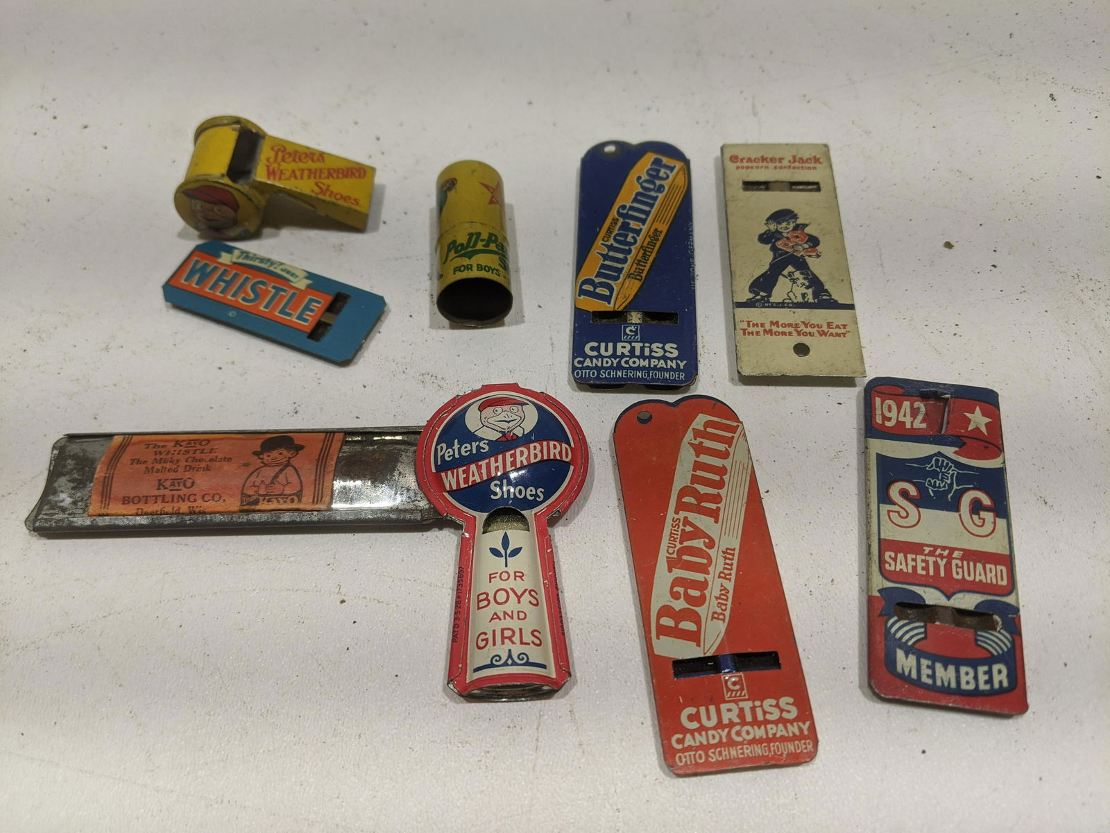 Lot 9 Vintage Metal Advertising Whistles Butterfinger: Lot 9 Vintage Metal Advertising Whistles including Butterfinger, Babe Ruth, Weatherbird, Poll-Parrot, Safety Guard, Cracker Jack and Thirsty Whistle. Condition:Mild wear with age Shipping:We offer in-