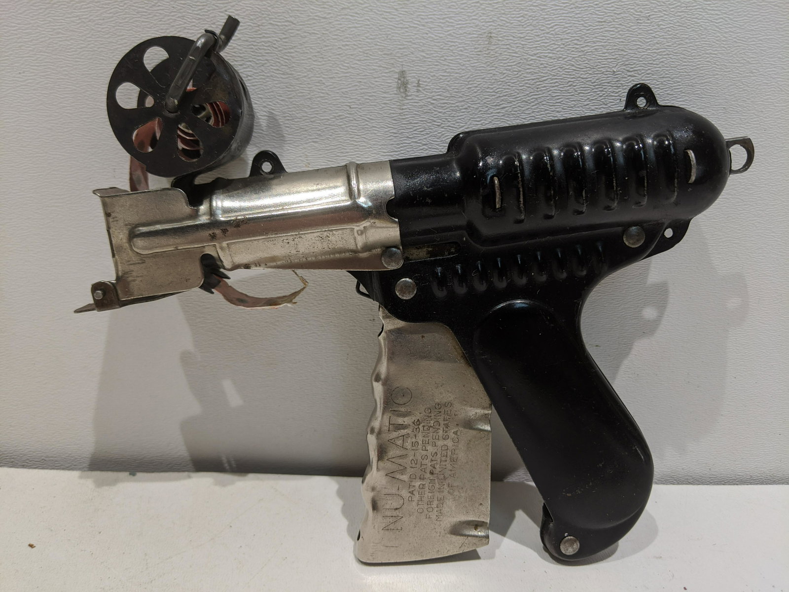 1936 Nu-Matic Space Cap-Gun w/ Cap Reel: 1936 Nu-Matic Space Cap-Gun w/ Cap Reel. Measurements in inches: 7 long Condition:Normal wear with age and use Shipping:We offer in-house shipping. Item(s) will be packed after invoice is paid and shi