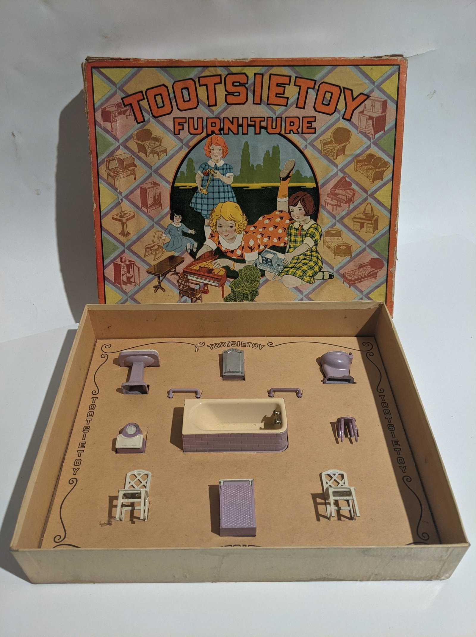 c1930 Tootsietoy Purple Bathroom Furniture in Box: c1930 Tootsietoy Purple Bathroom Furniture in Box. Condition:Normal wear with age, more wear to box Shipping:We offer in-house shipping. Item(s) will be packed after invoice is paid and shipping charg
