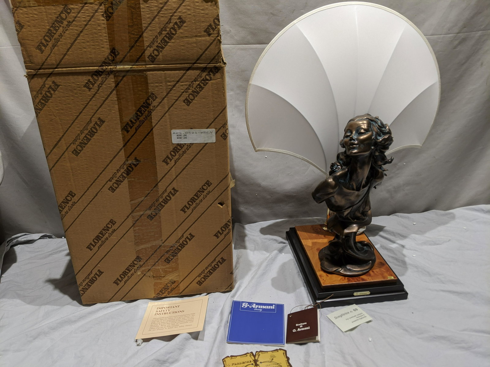 Giuseppe Armani Florence Sculpture Secret Lover & Shade: Giuseppe Armani Florence Sculpture Secret Lover & Shade in box with papers. Measurements in inches: 14 1/2 high, 22 with shade x 10 x 7 1/2 base Condition:New in box, never used. Missing Styrofoam in 