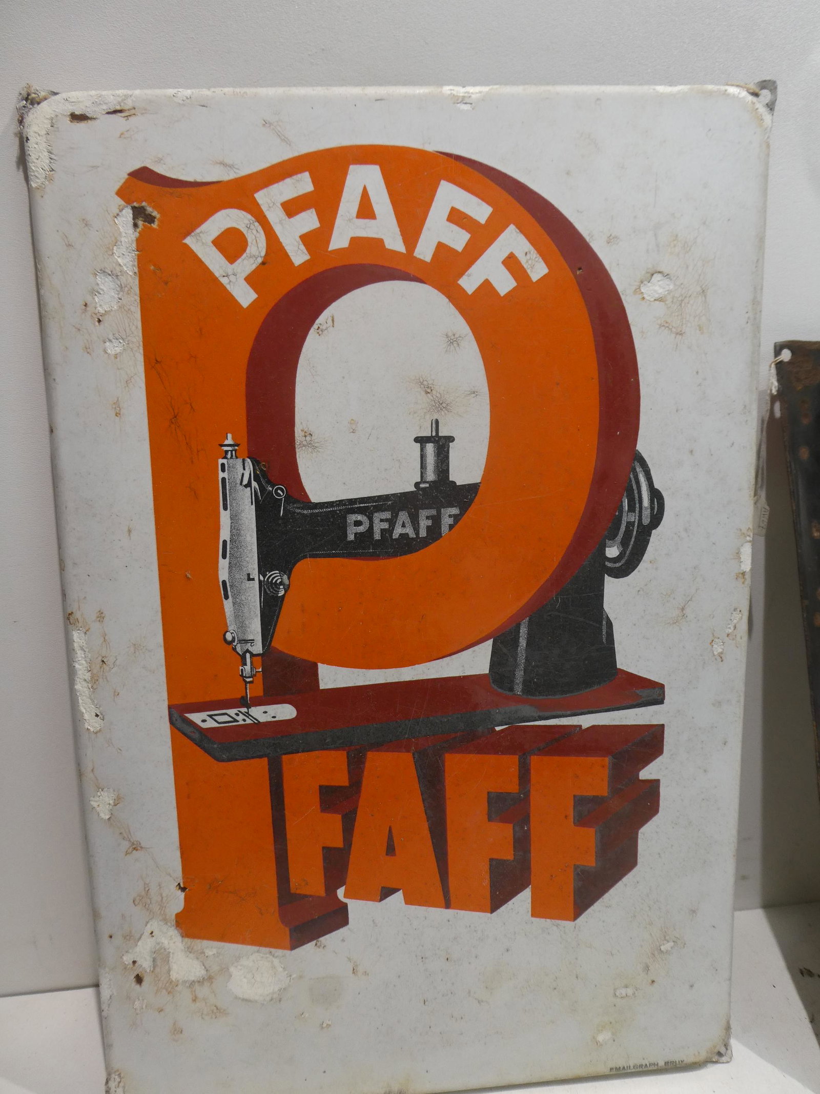 Antique Porcelain Pfaff Sewing Machine Wall Sign: Antique Porcelain Pfaff Sewing Machine Wall Sign. Measurements in inches: 16 x 24 Condition:Well worn with lots of porcelain chips Shipping:We offer in-house shipping. Item(s) will be packed after inv
