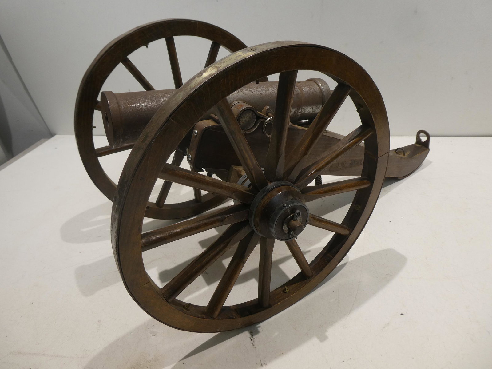 Antique Wood & Cast Iron Model Floor Cannon: Antique Wood & Cast Iron Model Floor Cannon. Measurements in inches: 23 long x 12 high x 10 Condition:Mild wear with air and use Shipping:We offer in-house shipping. Item(s) will be packed after invoi