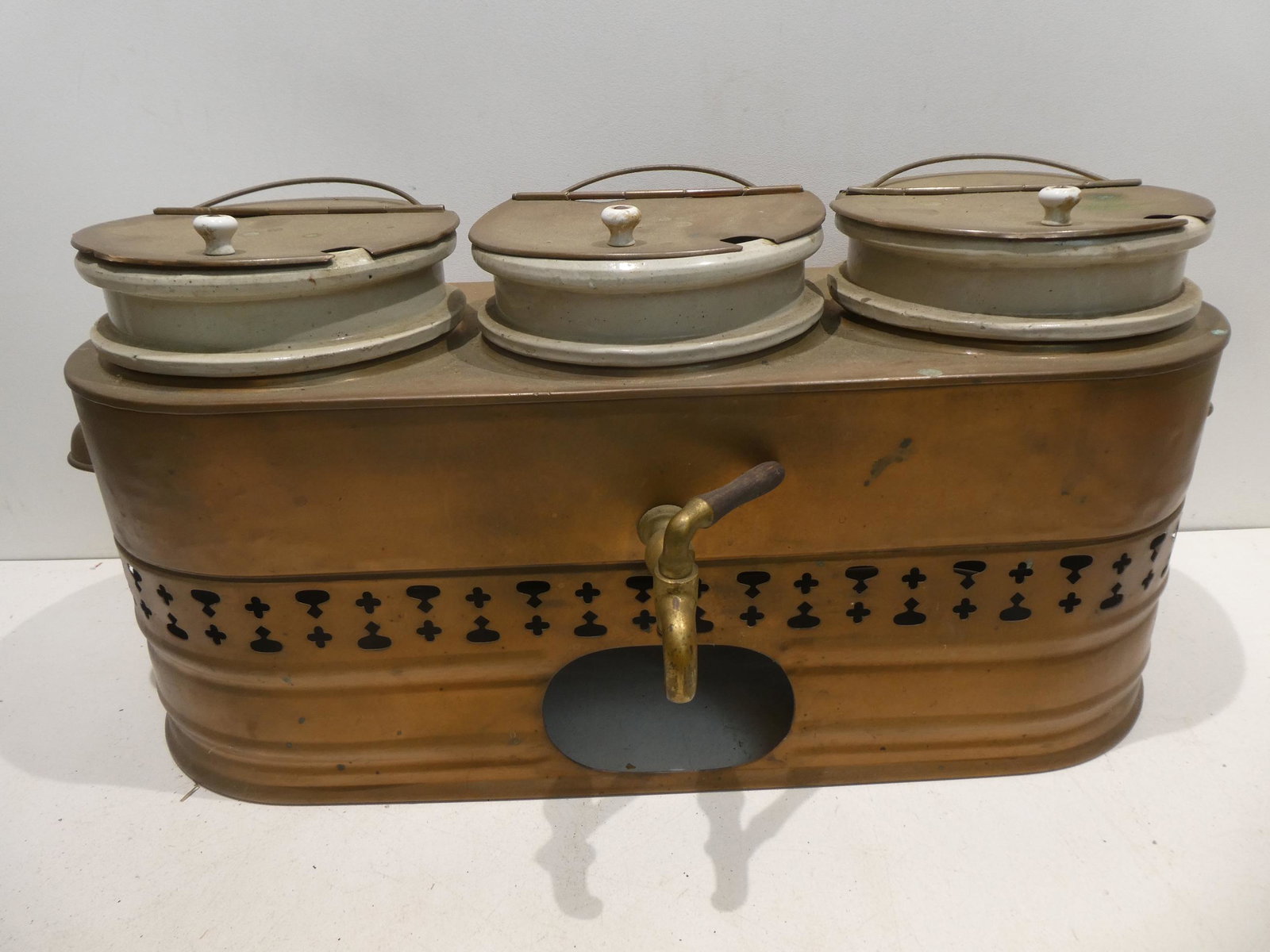 Antique Brass & Crock Ice Cream Parlor Fudge Dispenser: Antique Brass & Crock Ice Cream Parlor Carmel and other Dispenser. Measurements in inches: 12 high x 24 x 8 Condition:Needs good cleaning Shipping:We offer in-house shipping. Item(s) will be packed af