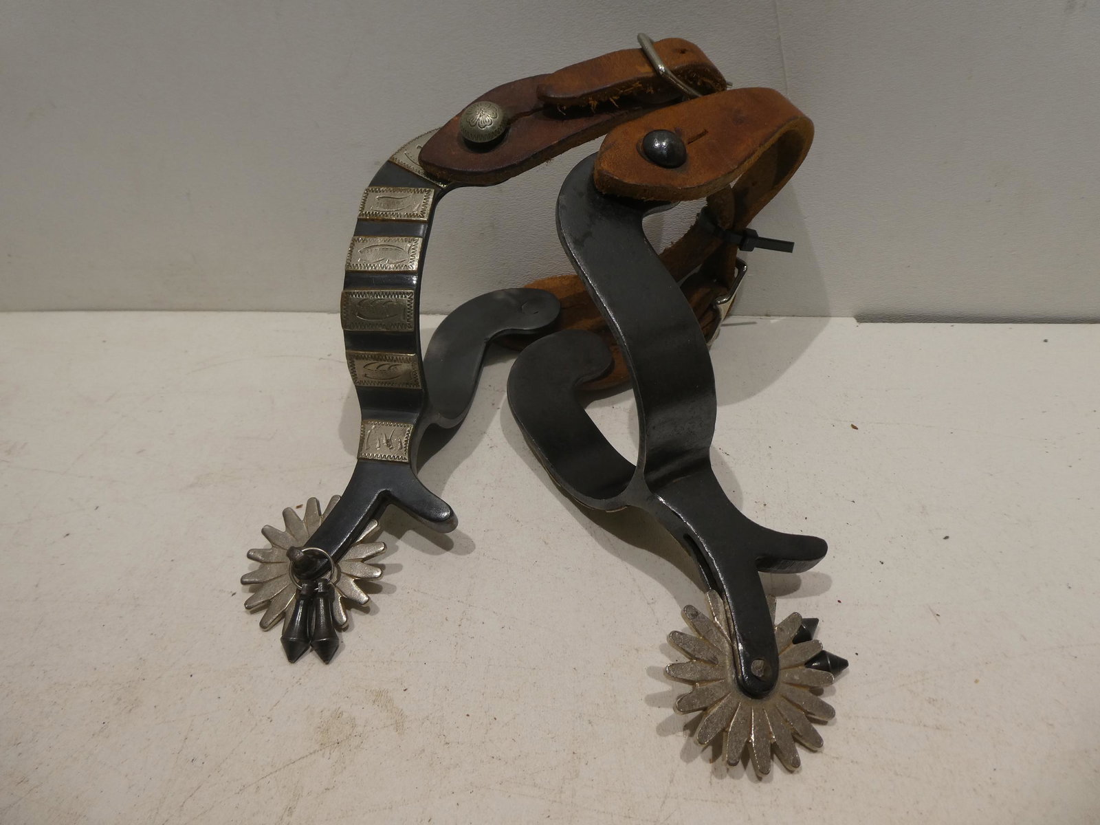 Vintage Steel & Leather Ornate Cowboy Western Spurs: Vintage Steel & Leather Ornate Cowboy Western Spurs. Condition:Has wear with age and use Shipping:We offer in-house shipping. Item(s) will be packed after invoice is paid and shipping charge will be i