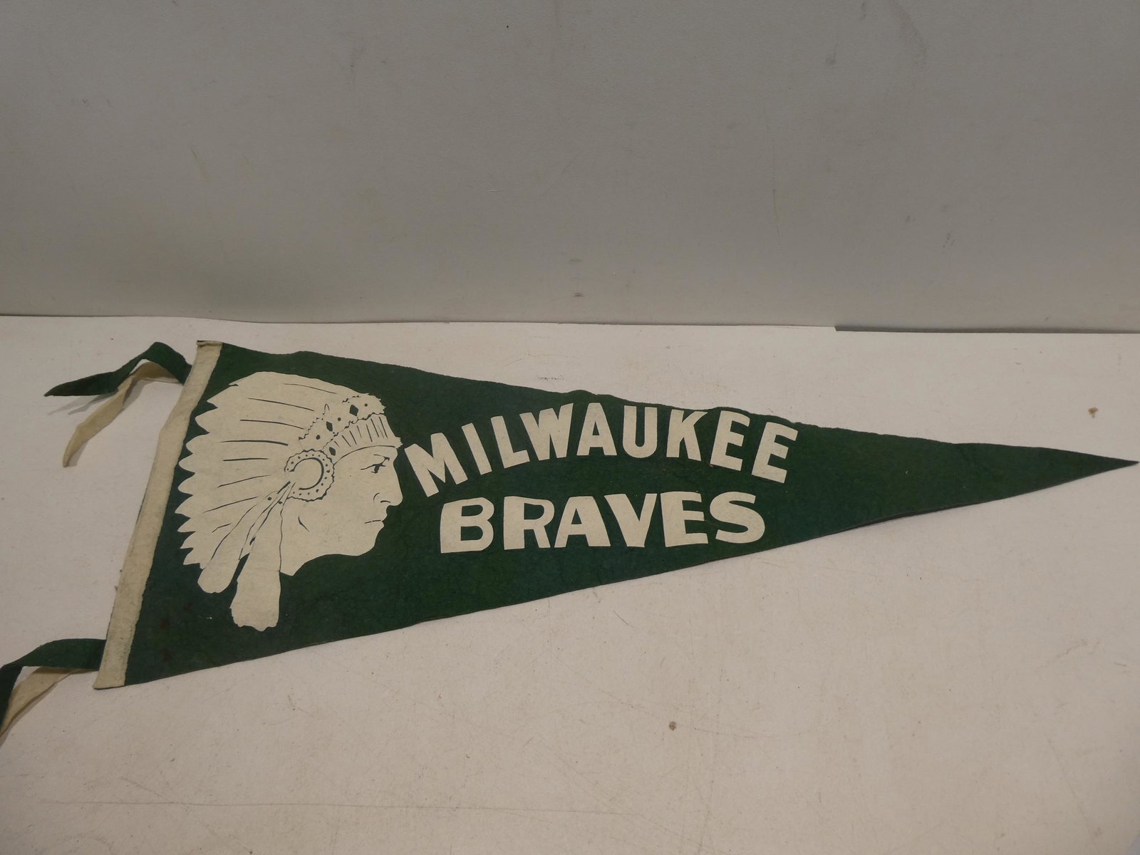 Early Cloth Eder MFG Milwaukee Braves Baseball Pennant: Early Cloth Eder MFG Milwaukee Braves Baseball Pennant. Measurements in inches: 28 long Condition:Has wear and soiling with age and use Shipping:We offer in-house shipping. Item(s) will be packed afte