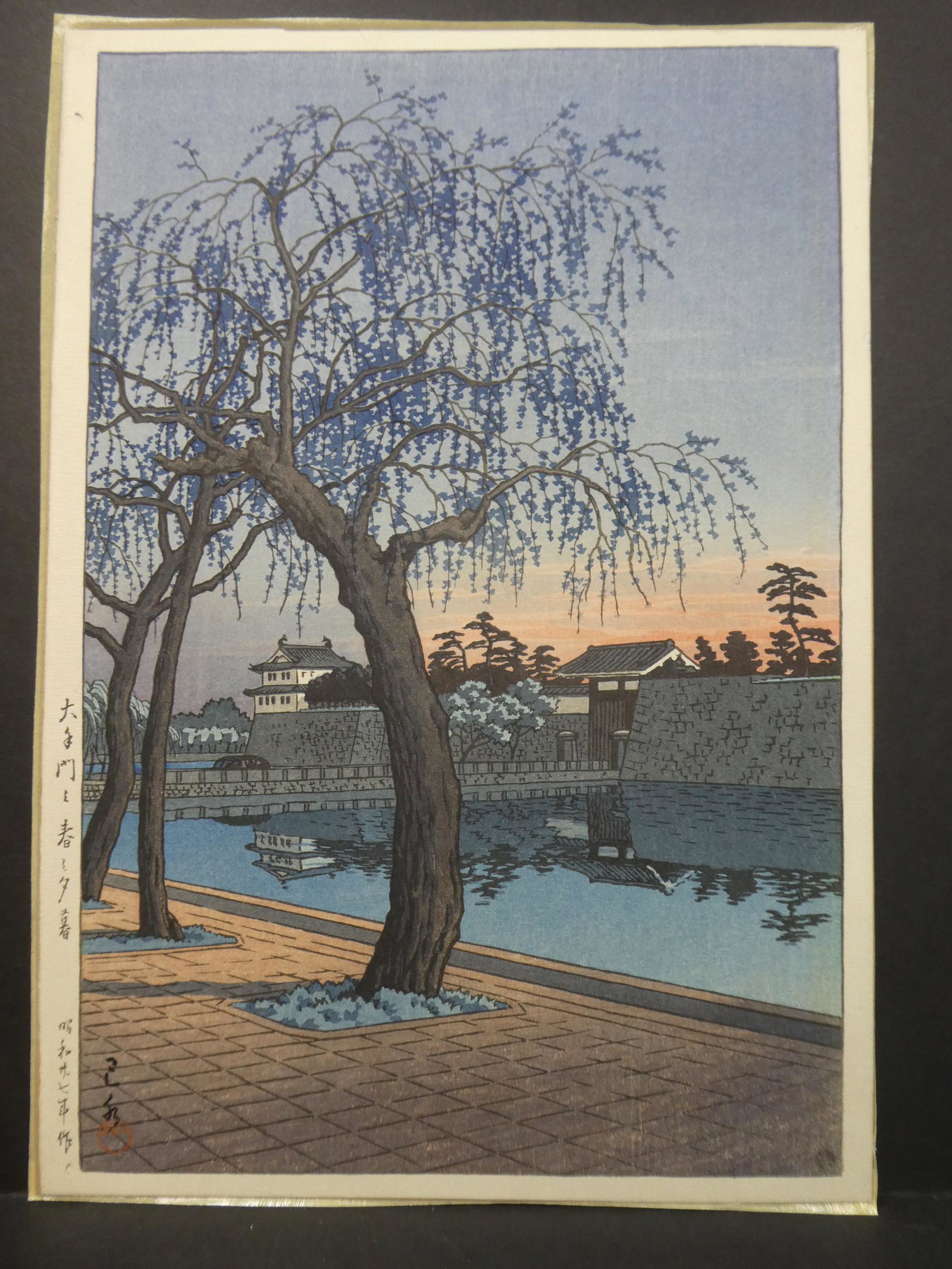 1952 Kawase Hasui Japanese Woodblock Print Spring: 1952 Kawase Hasui Japanese Woodblock Print Spring Evening at the Otemon Gate. Measurements in inches: 10 1/2 x 15 Condition:Glued on board, has trimming and toning Shipping:We offer in-house shipping.