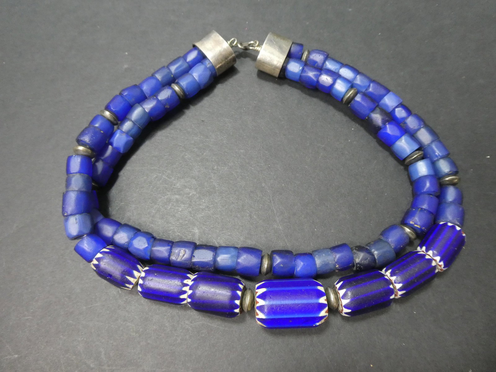 Antique African Blue Trade Beaded Necklace: Antique African Blue Trade Beaded Necklace with sterling silver closures. Measurements in inches: 16 long Condition:Good with no problems Shipping:We offer in-house shipping. Item(s) will be packed af
