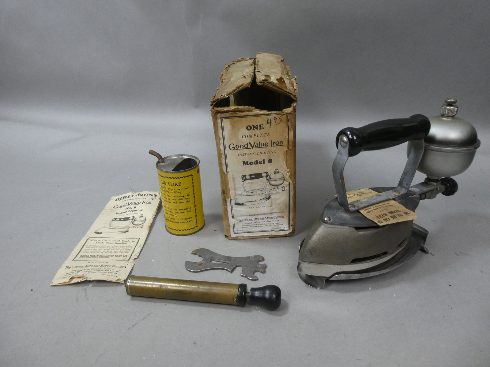 1930's Coleman Good Value Iron No 8 in box: 1930's Coleman Good Value Iron No 8 in original box with directions, wrench, pump, base and oil can. Condition:Box and directions are rough. Iron itself is very clean Shipping:We offer in-house shippi
