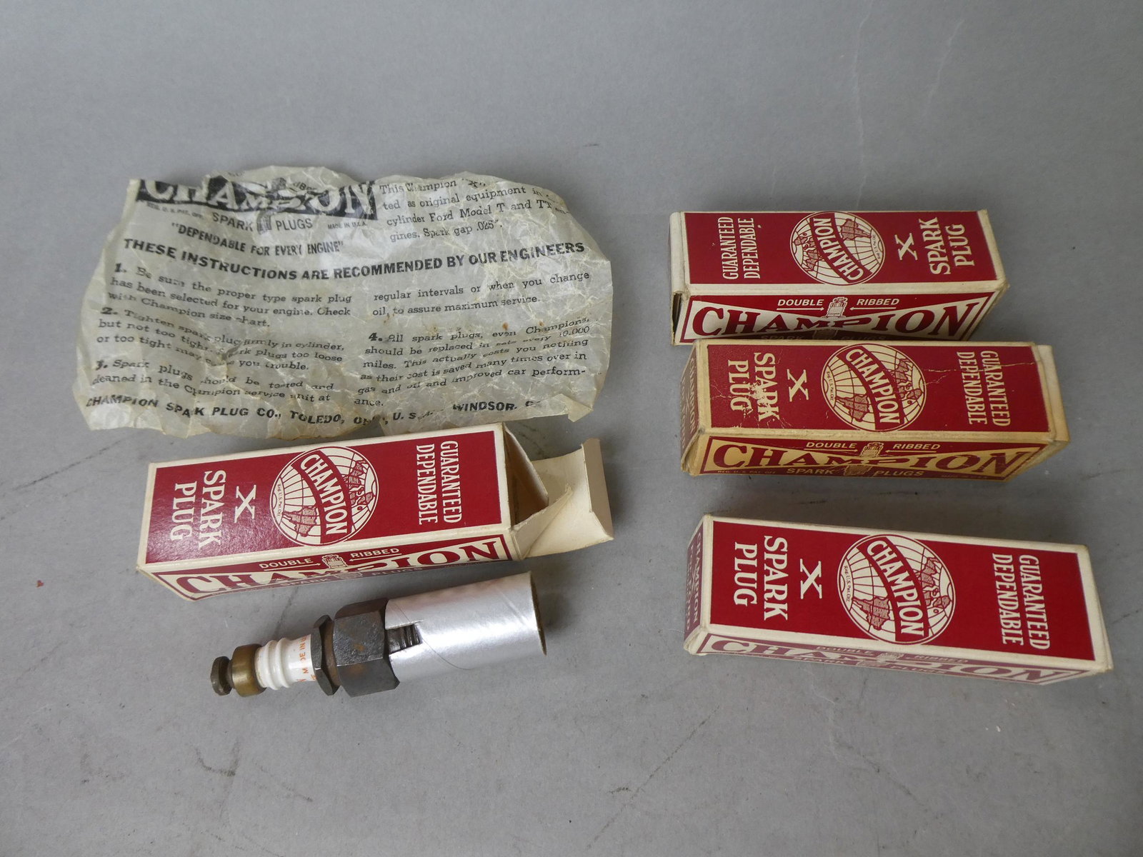 Set 4 NOS Champion Model X Spark Plugs for Model T: Set 4 NOS Champion Model X Spark Plugs for Model T. Condition:Some wear to boxes Shipping:We offer in-house shipping. Item(s) will be packed after invoice is paid and shipping charge will be invoiced 