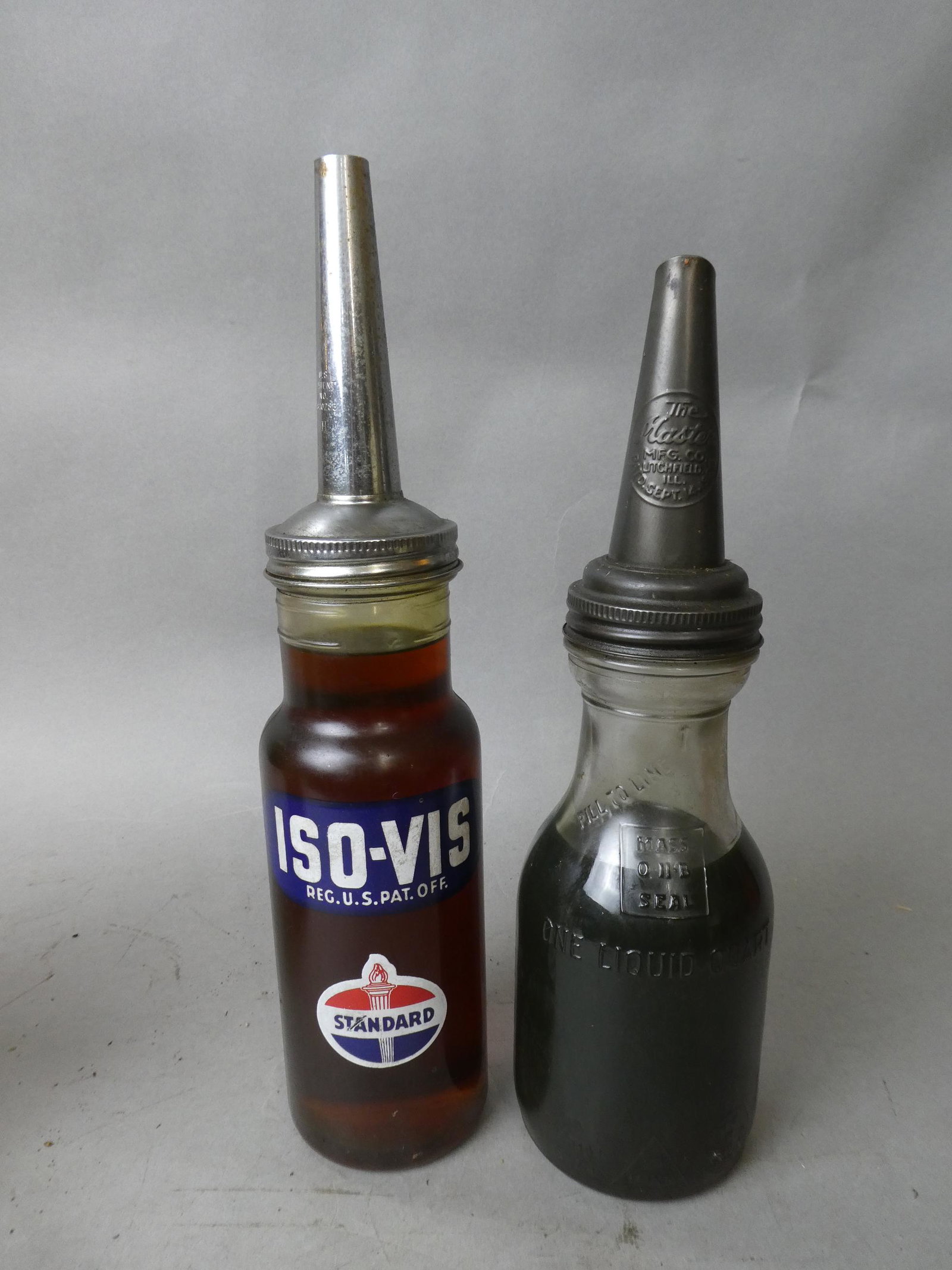 2 Antique Glass Oil Quart Bottles Standard Gas & Master: 2 Antique Glass Oil Quart Bottles Standard Gas & Master MFG CO. Measurements in inches: 14 and 15 high Condition:Good with no problems Shipping:We offer in-house shipping. Item(s) will be packed after