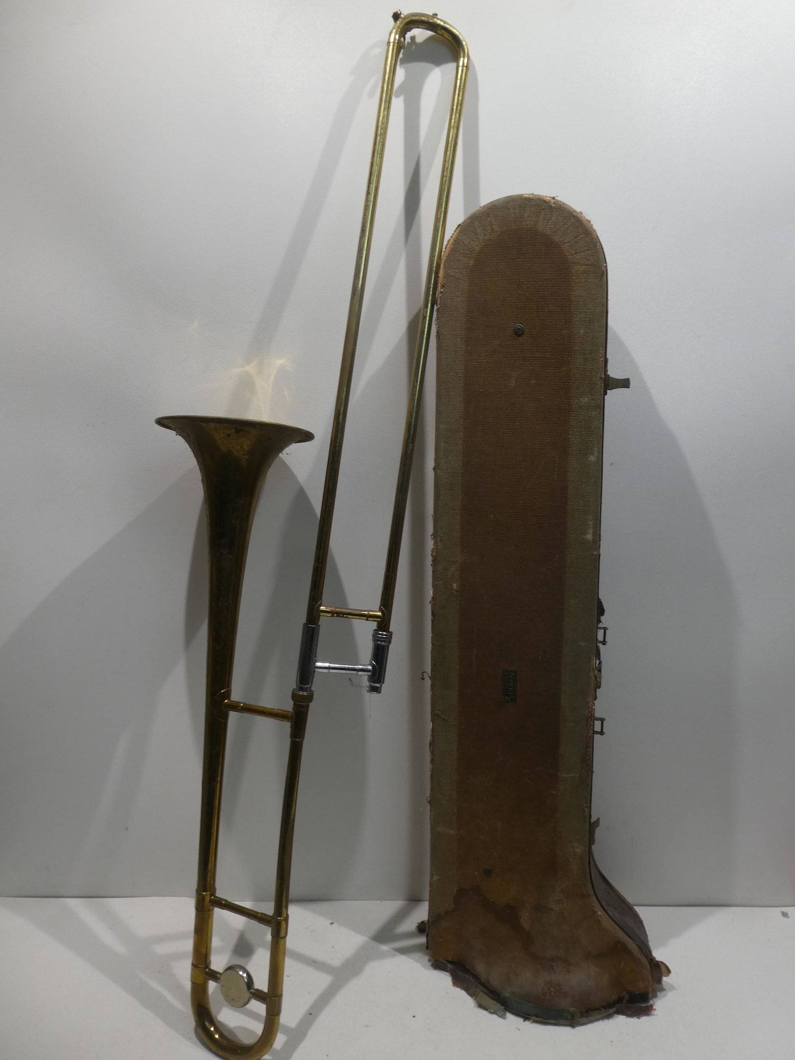 Antique HA Selmer Bundy Brass Trombone w/ Case: Antique HA Selmer Bundy Brass Trombone w/ Case with heavy brass Selmer mouthpiece. Measurements in inches: 45 long Condition:Has wear and dirt with age, Case is very rough. Slides moves smoothly Shipp
