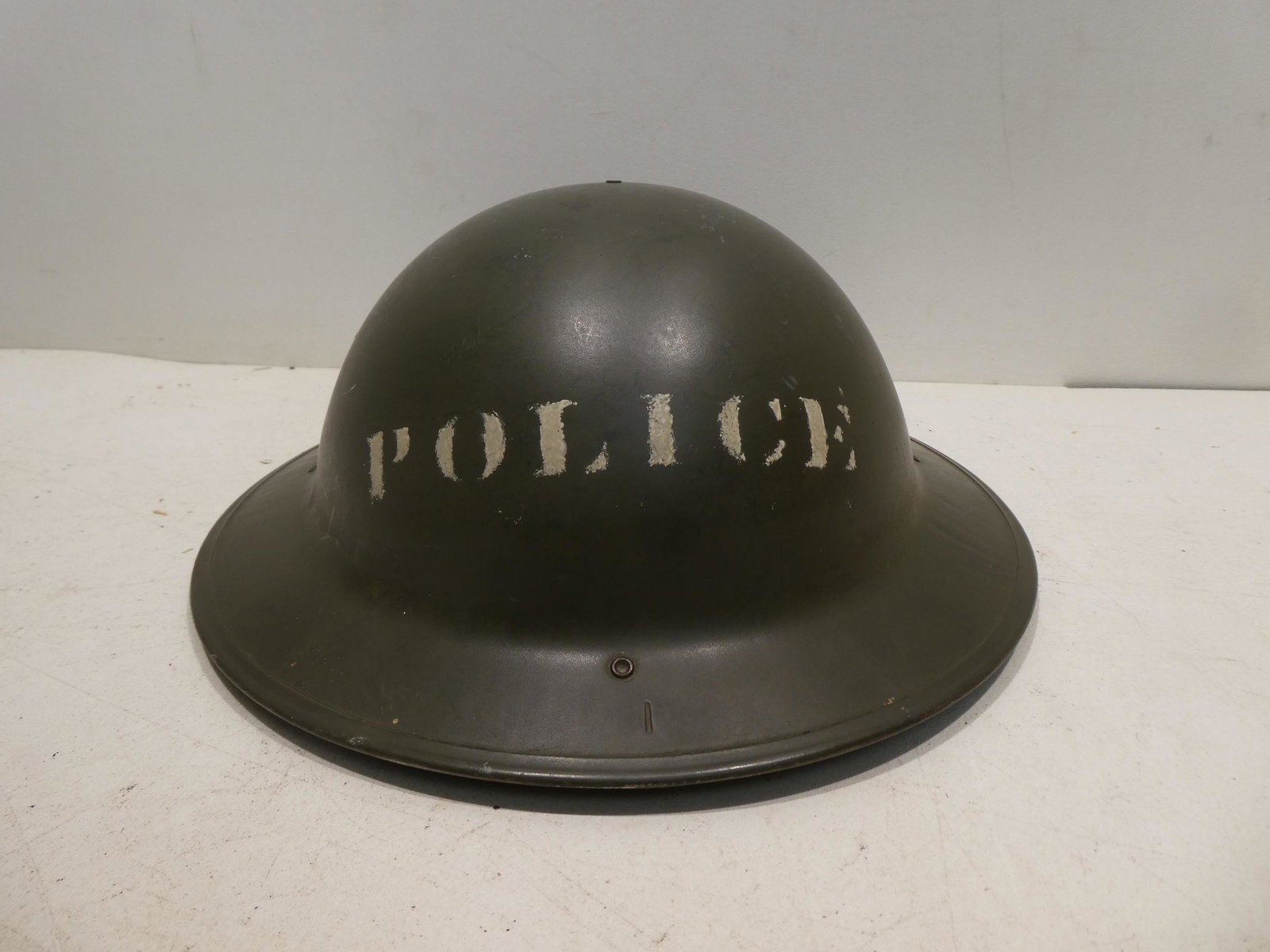 Vintage Green Military Police Brodie Style Helmet: Vintage Green Military Police Brodie Style Helmet with Sanitary lining. Measurements in inches: 9 x 8 lining Condition:Good with no problems Shipping:We offer in-house shipping. Item(s) will be packed