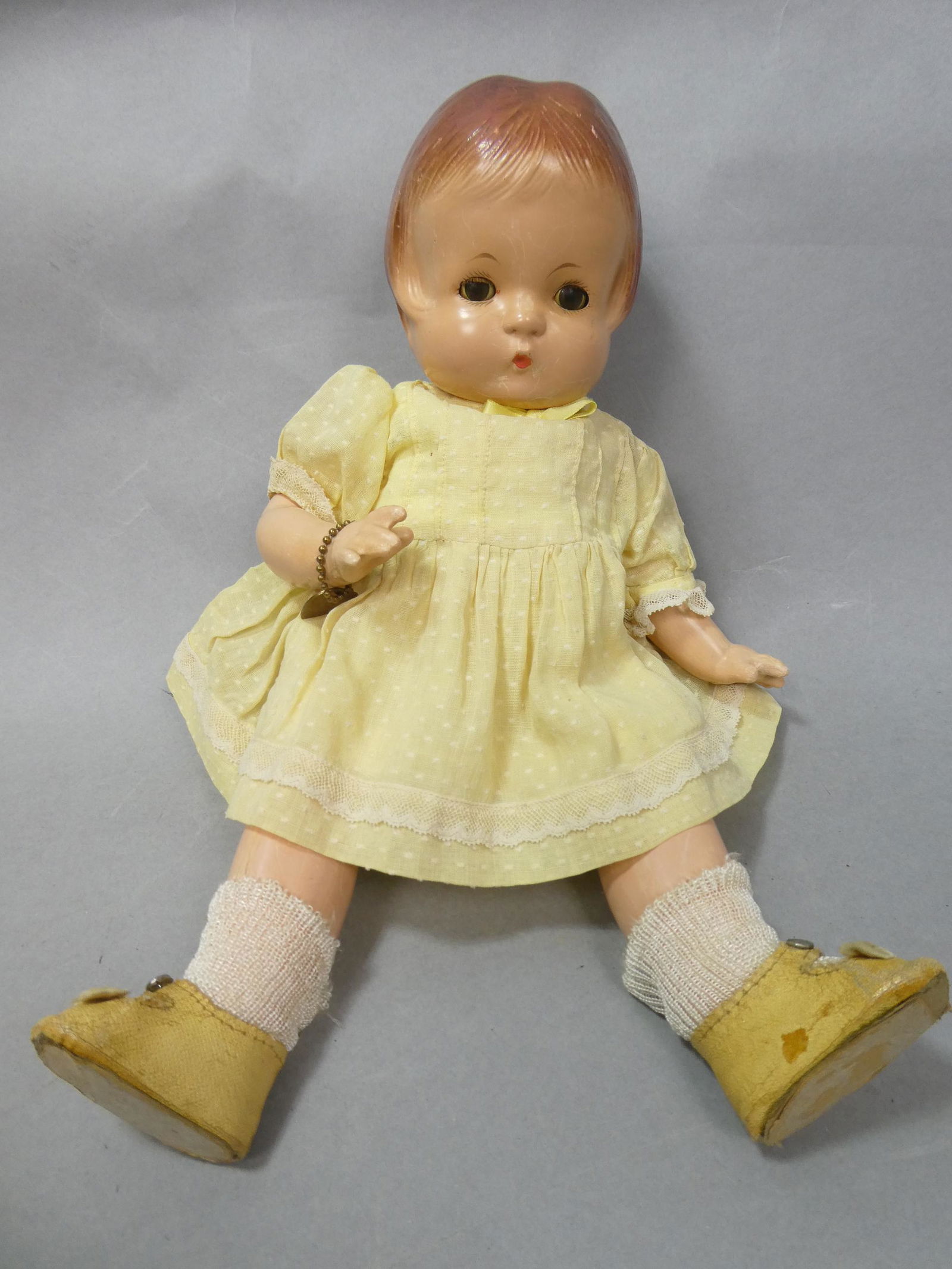 Vintage Effanbee Composition Patsy Doll w/ Metal Tag: Vintage Effanbee Composition Patsy Doll w/ Metal Tag and clothes. Measurements in inches: 13 high Condition:Has some crazing Shipping:We offer in-house shipping. Item(s) will be packed after invoice i