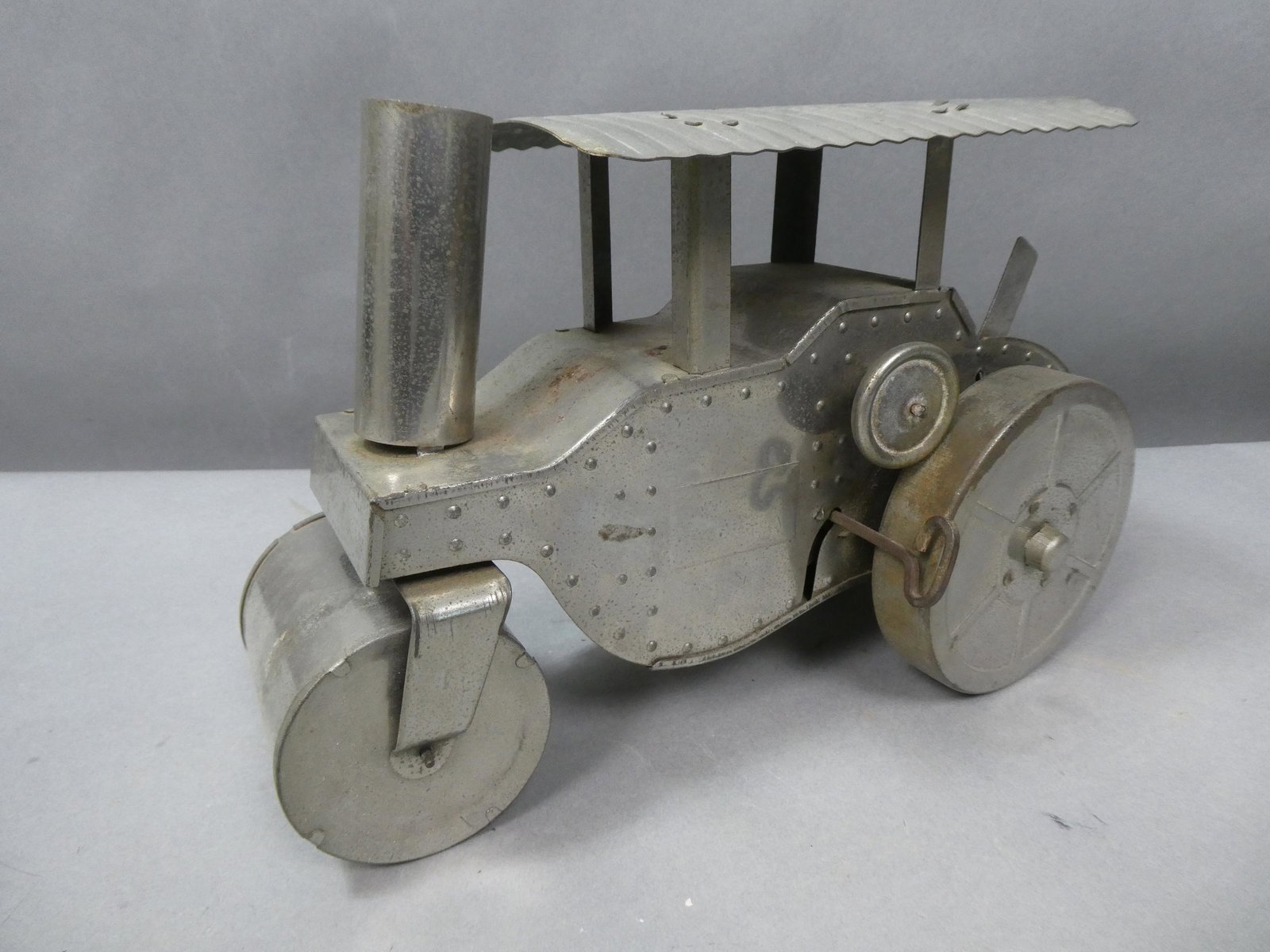 Antique Nickel Plated Wind Up Steam Road Roller: Antique Nickel Plated Wind Up Steam Road Roller. Measurements in inches: 12 long Condition:Works fine, has some surface pitting Shipping:We offer in-house shipping. Item(s) will be packed after invoic