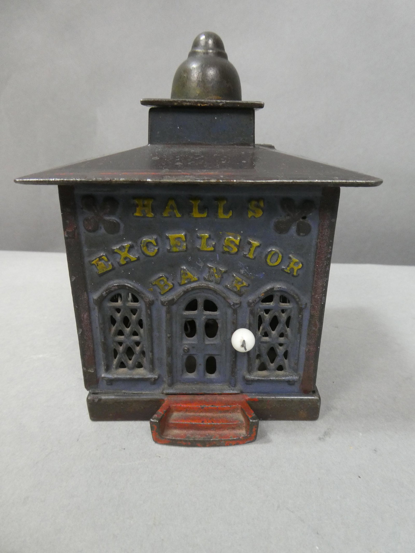 1860 Original Cast Iron Hall's Excelsior Mechanical Bank: 1860 Original Cast Iron Hall's Excelsior Mechanical Bank, Pull knob on top and top opens and monkey pops out. Measurements in inches: 6 high x 4 square Condition: Good with no problems Shipping: We of