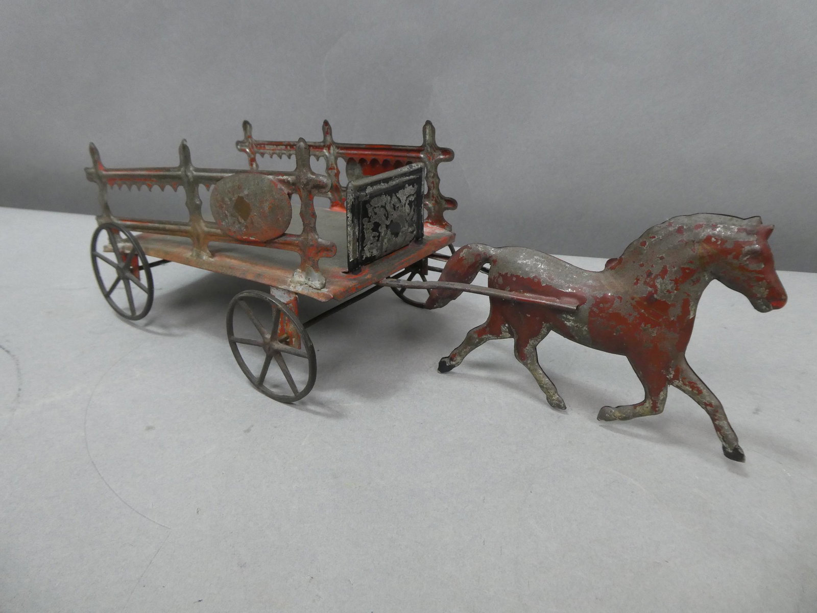Antique Painted Tin Horse Pulling Trailer Toy: Antique Painted Tin Horse Pulling Trailer Toy. Measurements in inches: 13 long Condition:Has wear to paint Shipping:We offer in-house shipping. Item(s) will be packed after invoice is paid and shippin