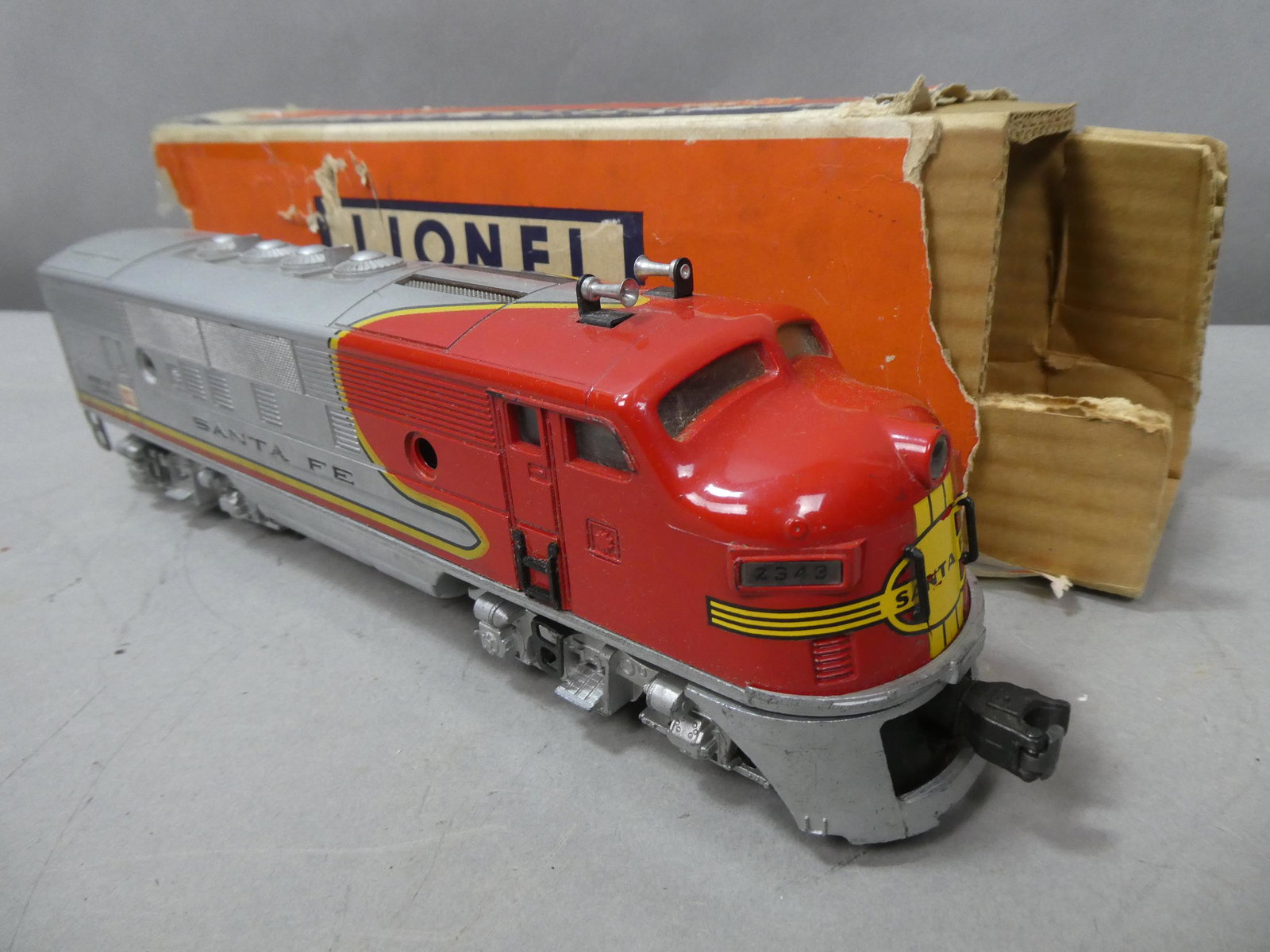 Lionel 2343T Sante Fe Dummy Engine w/ Box: Lionel 2343T Sante Fe Dummy Engine w/ Box. Condition:Mild wear with age, Box shows damage Shipping:We offer in-house shipping. Item(s) will be packed after invoice is paid and shipping charge will be 