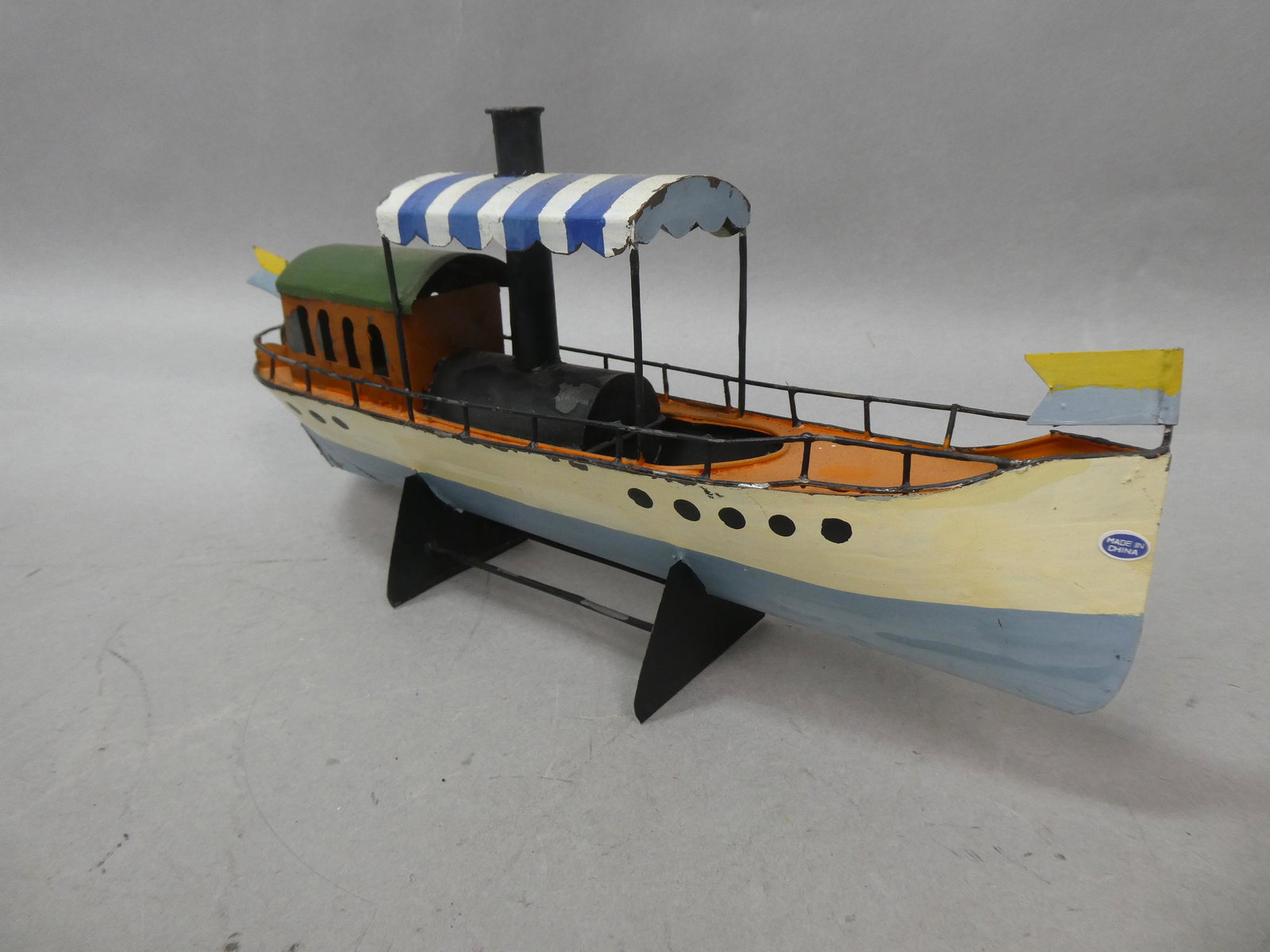Handmade Painted Metal Antique Steamboat on Stand: Handmade Painted Metal Antique Steamboat on Stand. Measurements in inches: 14 1/2 long Condition:Good with no problems Shipping:We offer in-house shipping. Item(s) will be packed after invoice is paid