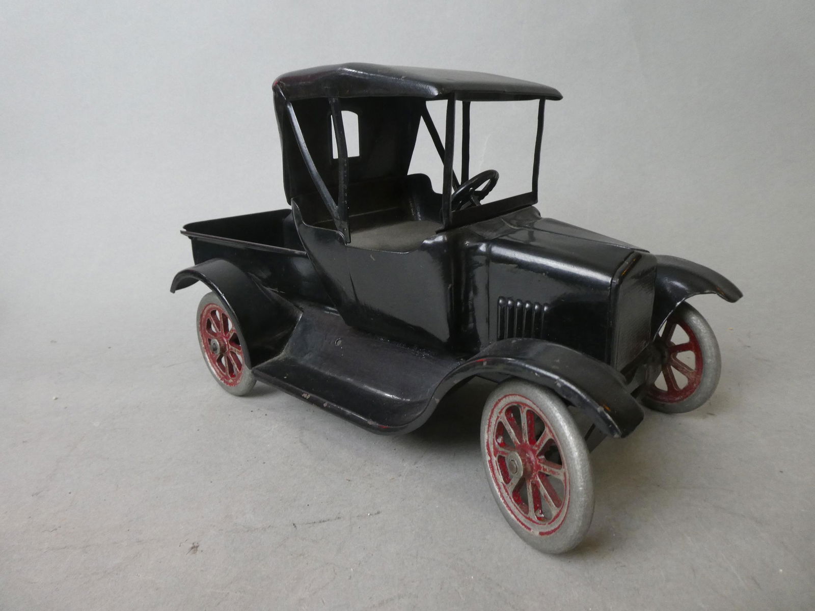 1920's Pressed Steel Buddy L Motel T Flivver Truck: 1920's Pressed Steel Buddy L Motel T Flivver Truck. Measurements in inches: 12 long Condition:Has been repainted at some point Shipping:We offer in-house shipping. Item(s) will be packed after invoice